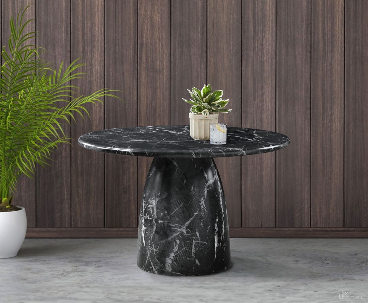 The appearance of Cosenza 48.5 Inch Marble Finish Concrete Dining Table In Black designed by Meridian in the modern / contemporary interior design. This black piece of furniture  was selected by 1StopBedrooms from Cosenza Collection to add a touch of cosiness and style into your home. Sku: 701Black-T Box 1/2 (Top);701Black-T Box 2/2 (Base). Table Base Style: Pedestal. Table Top Shape: Round. Material: Concrete. Size: 49".