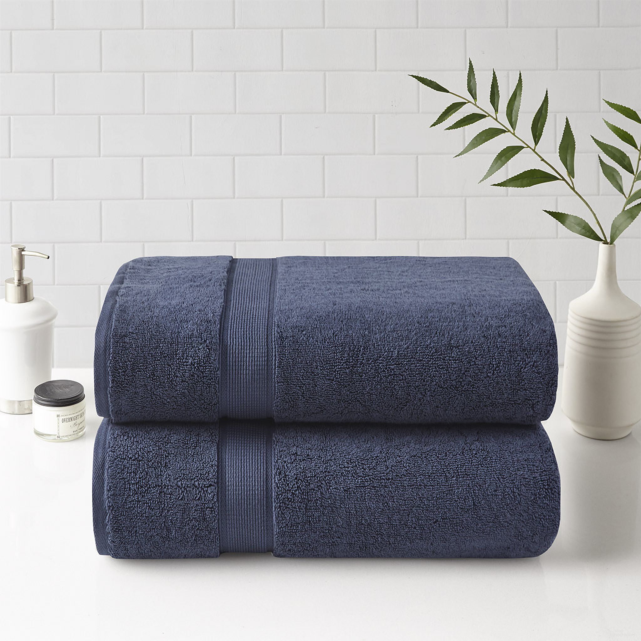 The appearance of Cotton Bath 2 Piece Sheet Set In Dark Blue designed by Olliix in the transitional interior design. This dark blue piece of furniture  was selected by 1StopBedrooms from 800gsm Collection to add a touch of cosiness and style into your home. Sku: MPS73-460. Material: Cotton.