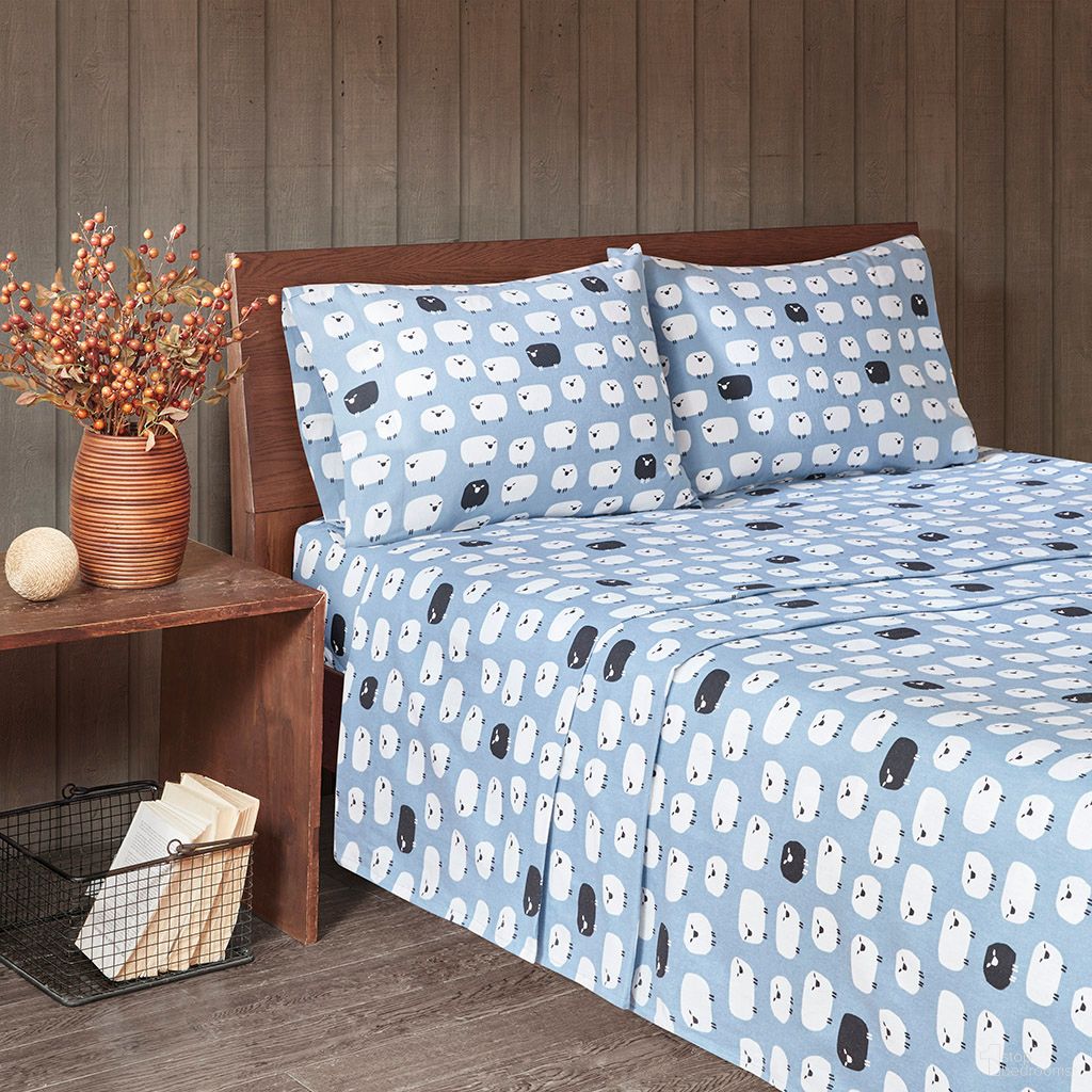 The appearance of Cotton Printed 4 Piece Queen Sheet Set In Blue Sheep designed by Olliix in the transitional interior design. This blue sheep piece of furniture  was selected by 1StopBedrooms from Flannel Collection to add a touch of cosiness and style into your home. Sku: WR20-2279. Bed Size: Queen. Material: Cotton.