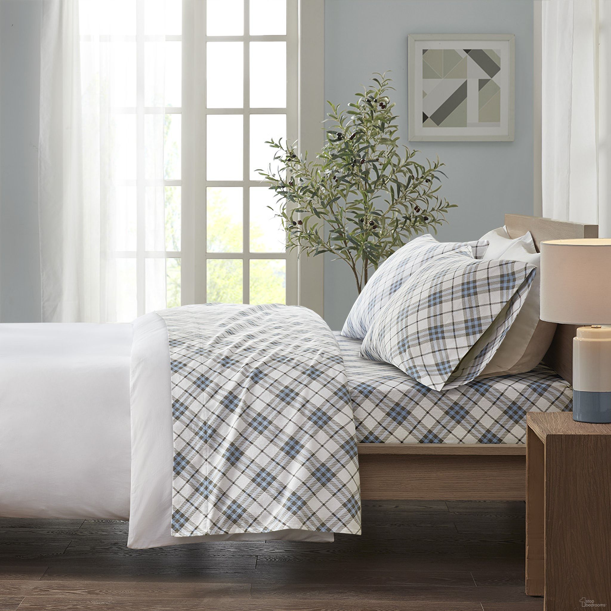 The appearance of Cozy Cotton Flannel 4 Piece California King Sheet Set In Blue Plaid designed by Olliix in the transitional interior design. This blue plaid piece of furniture was selected by 1StopBedrooms from Cozy Flannel Collection to add a touch of cosiness and style into your home. Sku: TN20-0085. Bed Size: California King. Material: Cotton.