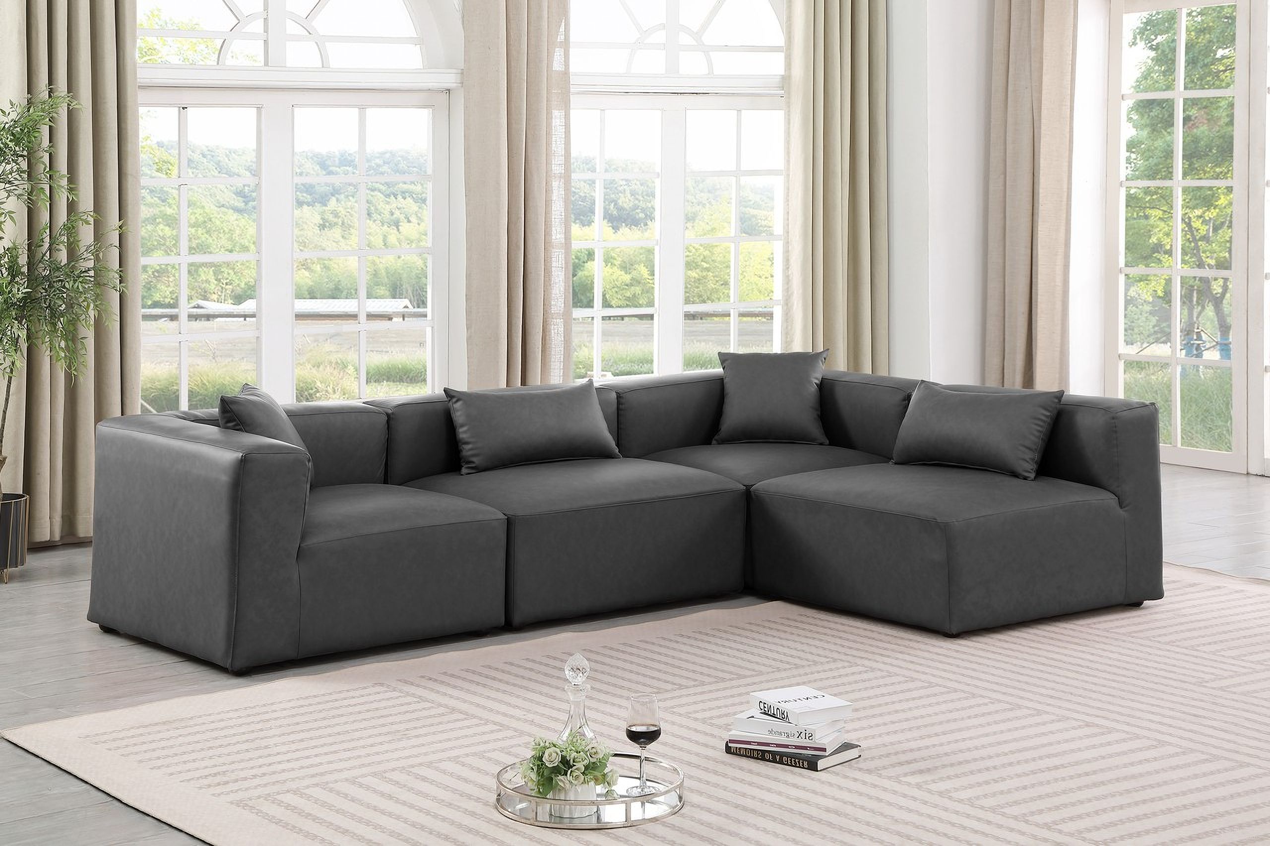 The appearance of Cube Vegan Leather 4 Piece Modular Sectional In Charcoal Grey designed by Meridian in the modern / contemporary interior design. This charcoal grey piece of furniture  was selected by 1StopBedrooms from Cube Collection to add a touch of cosiness and style into your home. Sku: 668Grey-Armless;668Grey-Armless;668Grey-Corner;668Grey-Corner. Material: Leather. Layout: Modular.