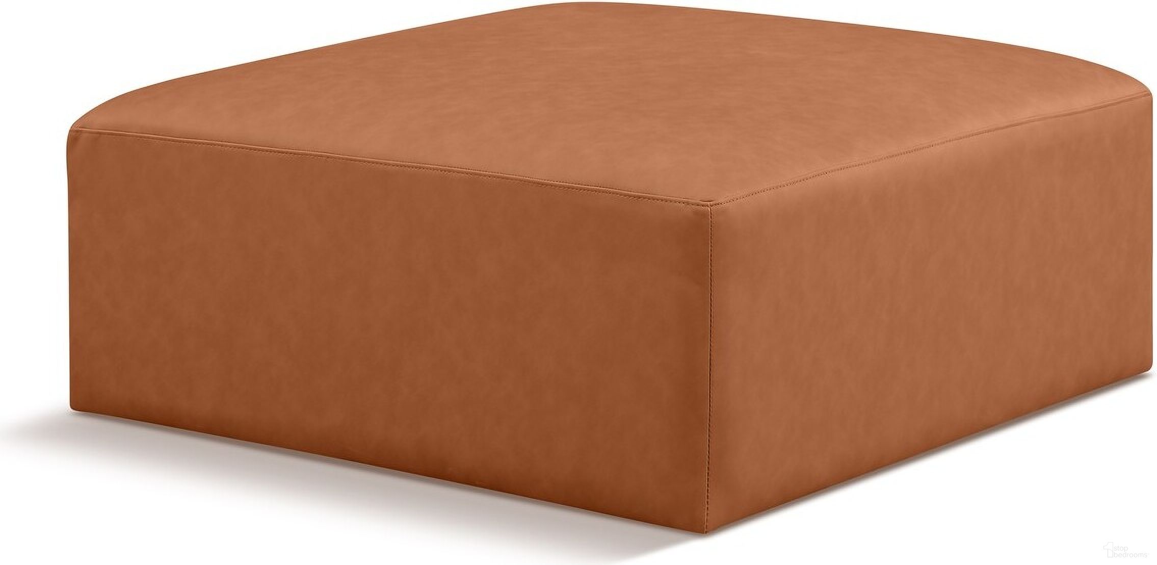 The appearance of Cube Vegan Leather Ottoman In Cognac designed by Meridian in the modern / contemporary interior design. This cognac piece of furniture  was selected by 1StopBedrooms from Cube Collection to add a touch of cosiness and style into your home. Sku: 668Cognac-Ott. Material: Leather.