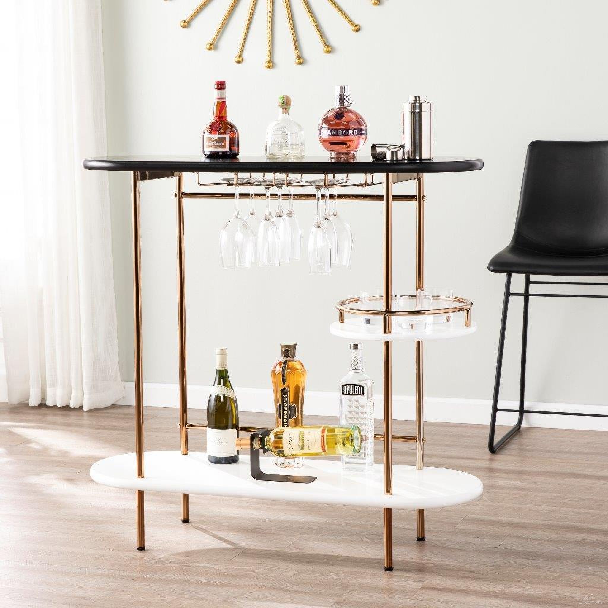 The appearance of Dagney Bar Table With Glassware Storage designed by SEI Furniture in the modern / contemporary interior design. This champagne piece of furniture  was selected by 1StopBedrooms from Dagney Collection to add a touch of cosiness and style into your home. Sku: HZ2053. Table Top Shape: Oval. Material: Wood.