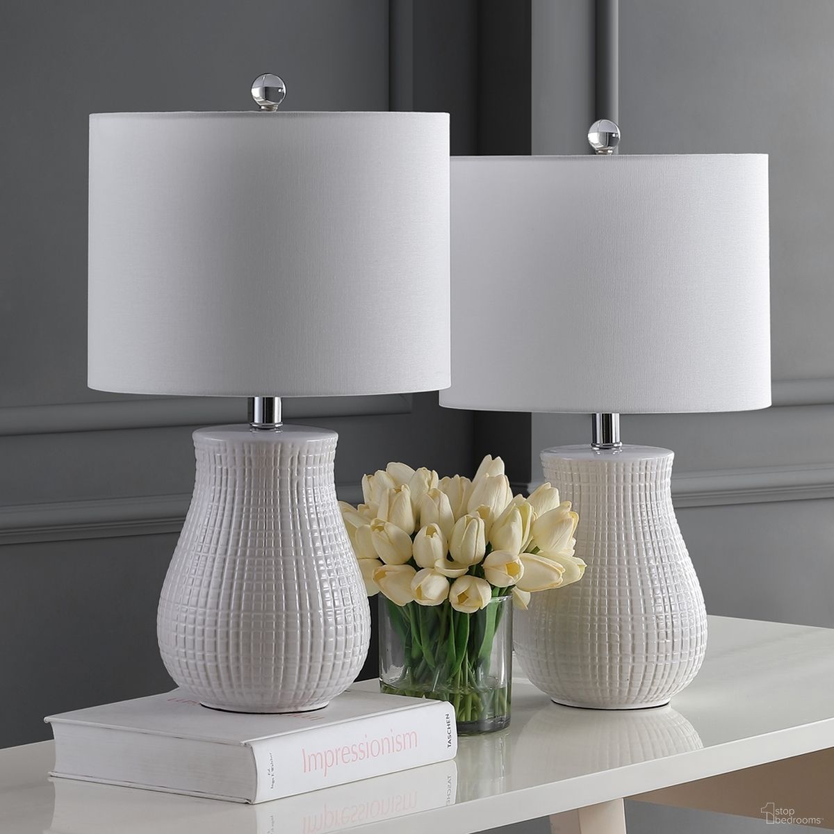 The appearance of Dayton White Table Lamp Set of 2 designed by Safavieh in the modern / contemporary interior design. This white piece of furniture  was selected by 1StopBedrooms from Safavieh TBL Collection to add a touch of cosiness and style into your home. Sku: TBL4140A-SET2. Material: Chrome.