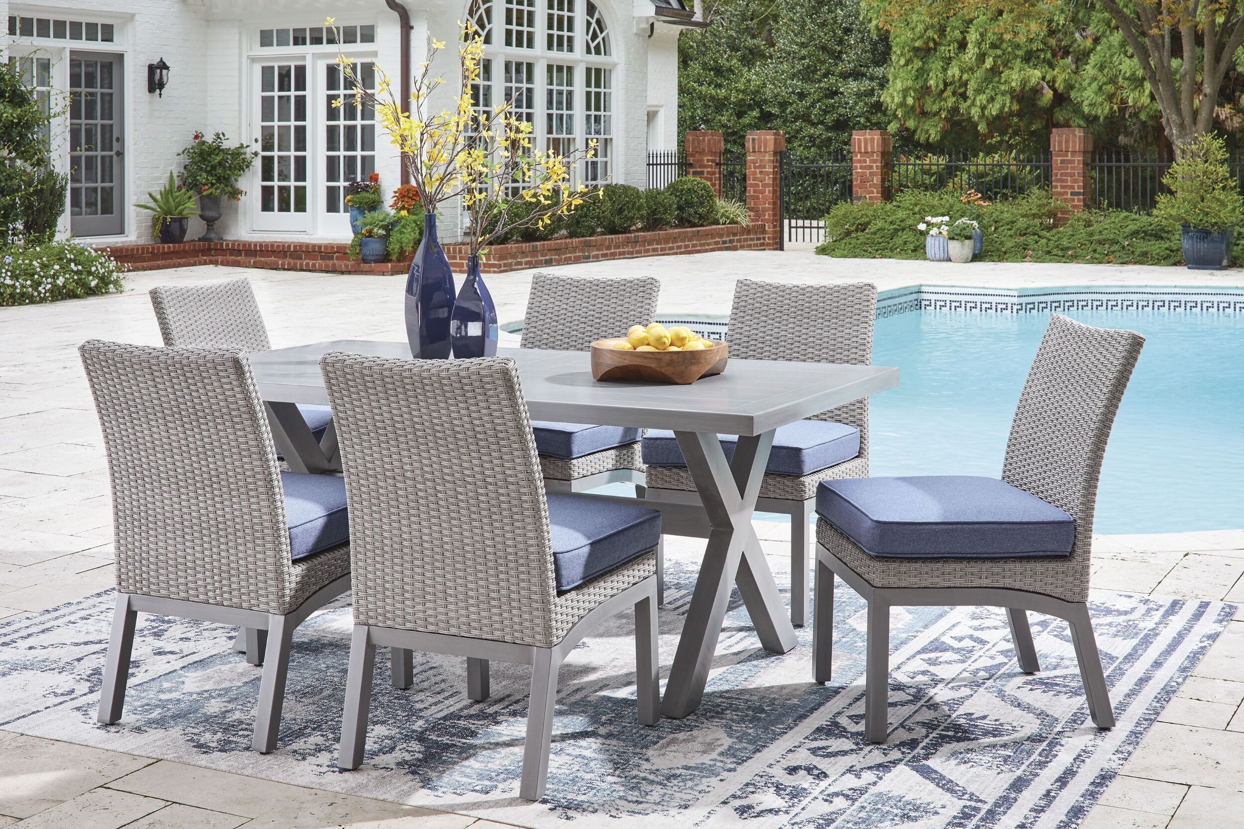 The appearance of Dillon Beach Rectangular Outdoor Dining Set In Gray designed by Signature Design by Ashley in the modern / contemporary interior design. This gray piece of furniture was selected by 1StopBedrooms from Dillon Beach Collection to add a touch of cosiness and style into your home. Sku: P418-625;P418-601. Table Top Shape: Rectangular. Material: Aluminium.