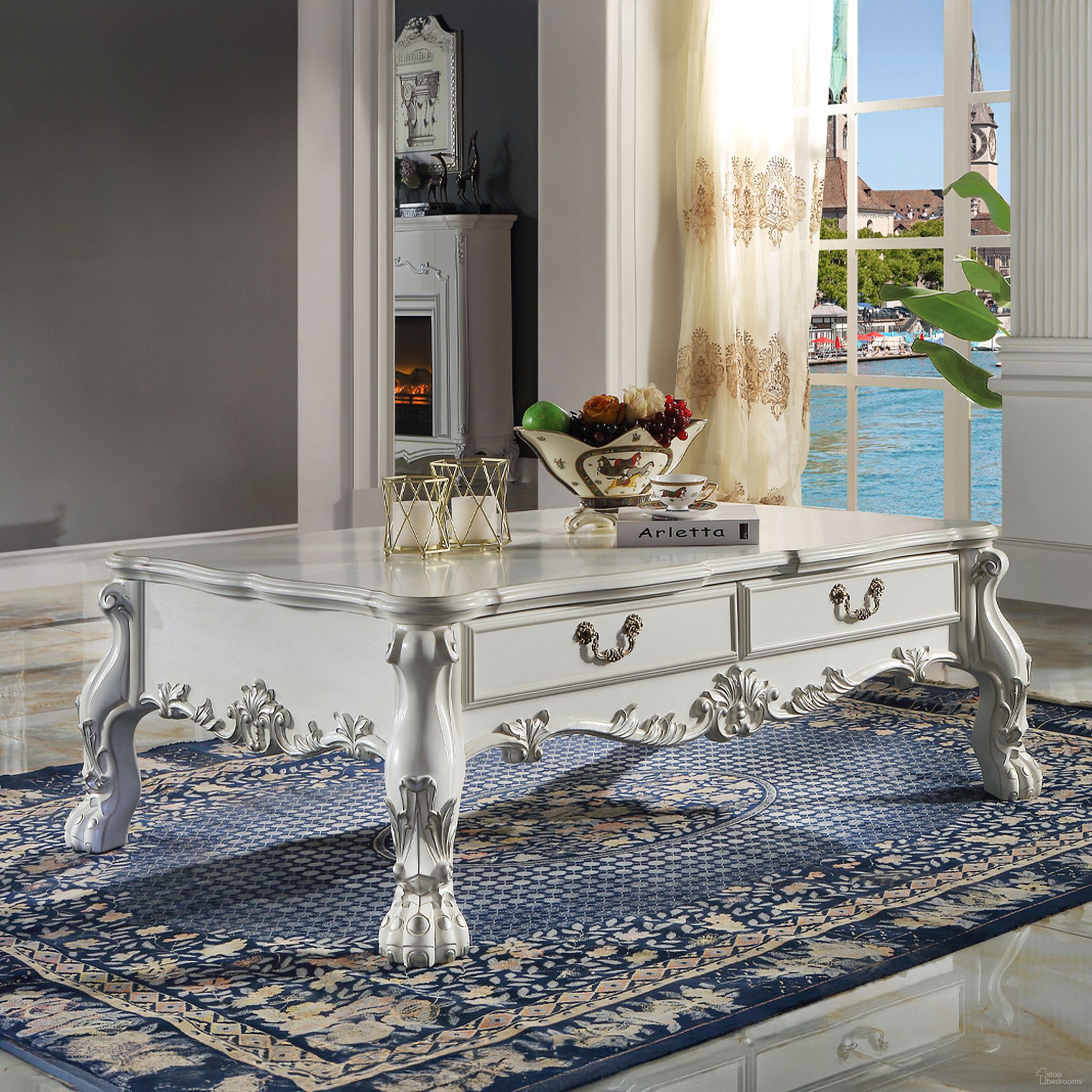 The appearance of Dresden Coffee Table with Scalloped Tabletop In Bone White designed by ACME in the transitional interior design. This bone white piece of furniture was selected by 1StopBedrooms from Dresden Collection to add a touch of cosiness and style into your home. Sku: LV01686. Material: Wood.