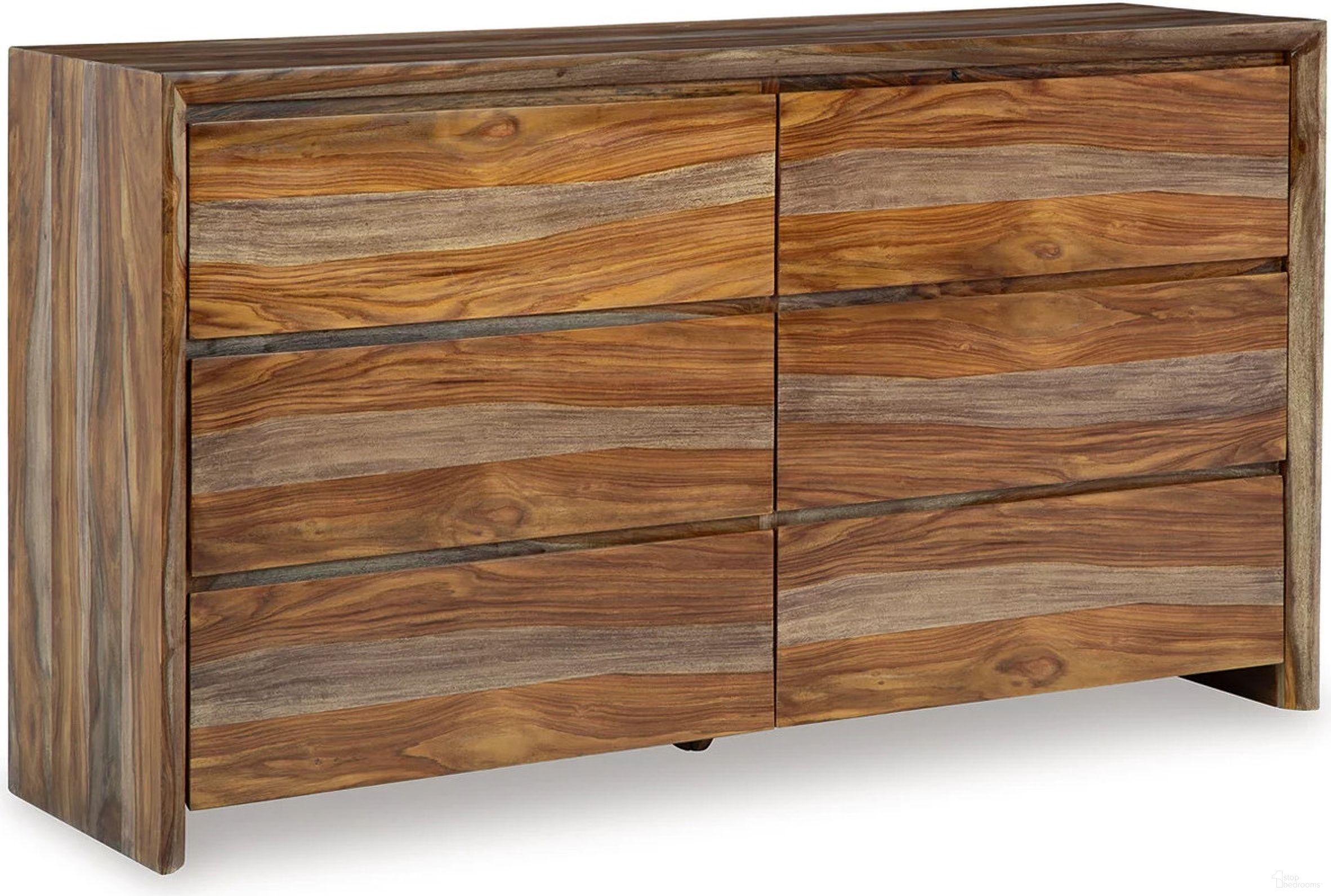 The appearance of Dressonni Dresser In Brown designed by Signature Design by Ashley in the modern / contemporary interior design. This brown piece of furniture  was selected by 1StopBedrooms from Dressonni Collection to add a touch of cosiness and style into your home. Sku: B790-31. Material: Wood.