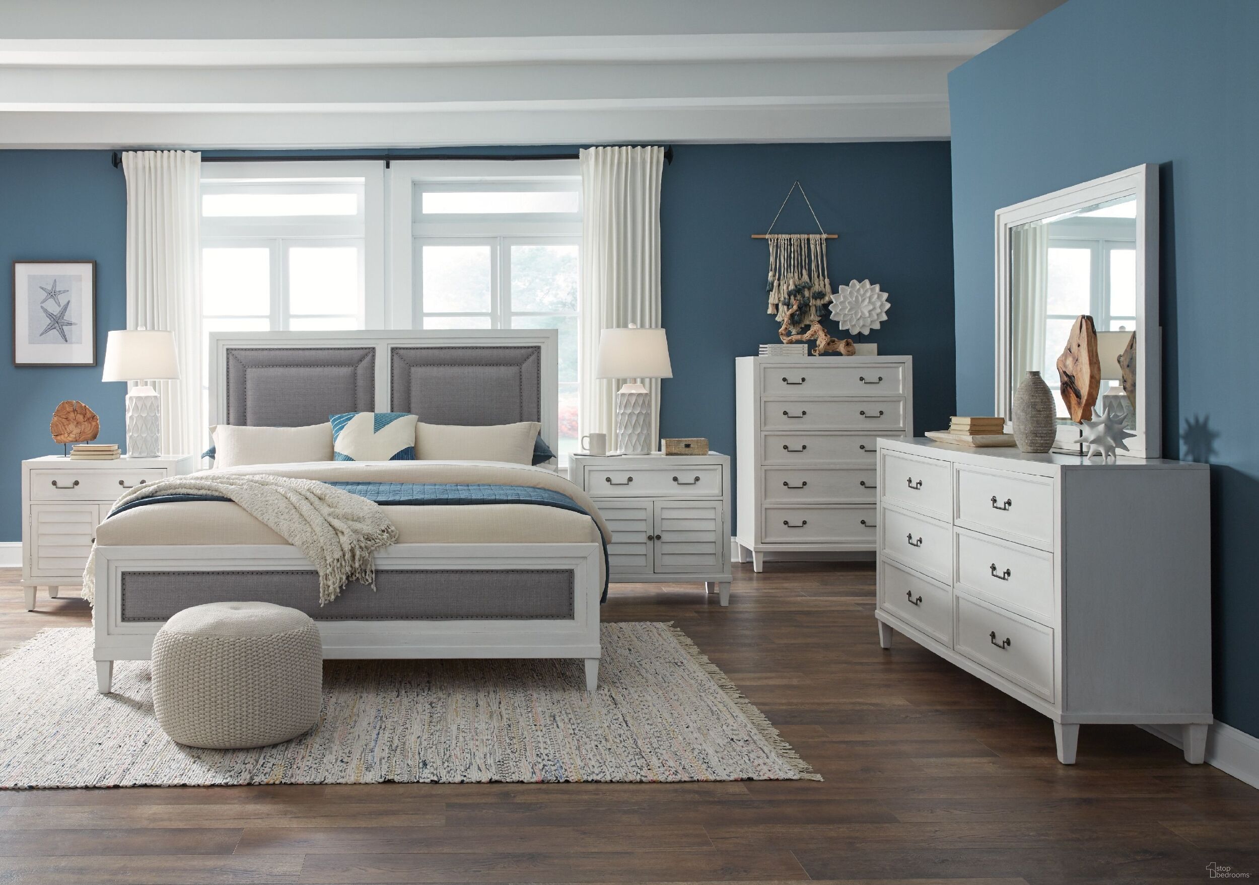 The appearance of Dunescape Panel Bedroom Set In White designed by American Woodcrafters in the transitional interior design. This white piece of furniture  was selected by 1StopBedrooms from Dunescape Collection to add a touch of cosiness and style into your home. Sku: 1210-957;1210-952;1210-880;1210-412. Bed Type: Panel Bed. Bed Size: Queen. Material: Mahogany.