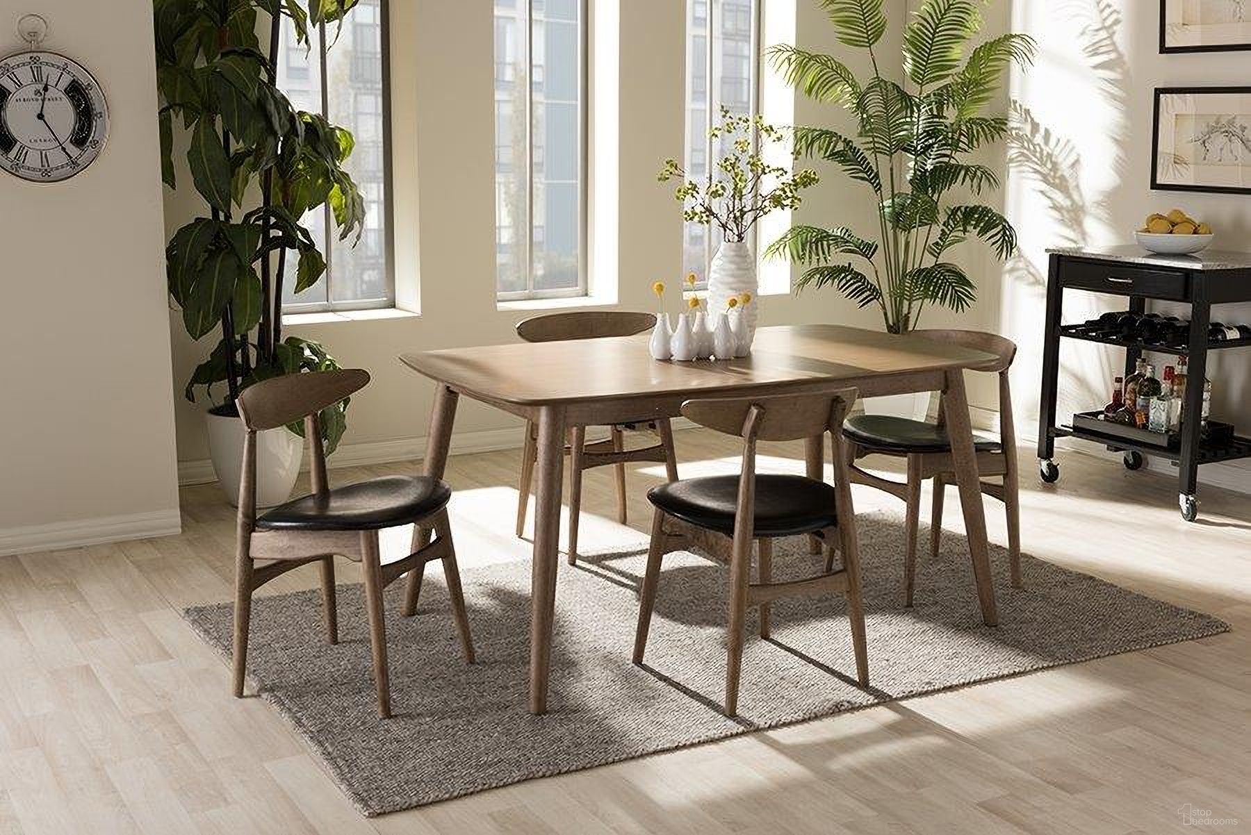 The appearance of Edna Mid-Century Modern French Black Faux Leather And Oak Light Brown Finishing Wood 5-Piece Dining Set designed by Baxton Studio in the transitional interior design. This light brown piece of furniture  was selected by 1StopBedrooms from Edna Collection to add a touch of cosiness and style into your home. Sku: Flora-French Oak 5PC Dining Set. Material: Rubberwood.
