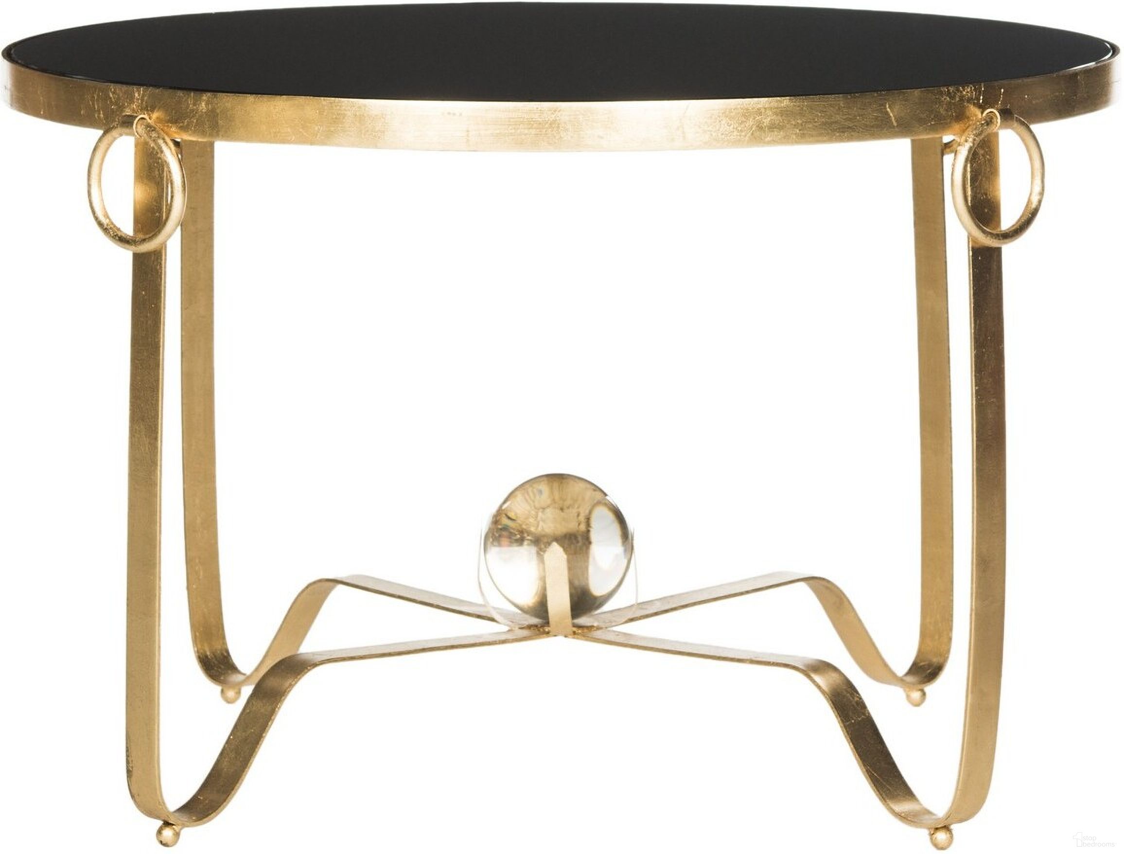 The appearance of Elisha Gold Leaf Round Coffee Table with Glass Ball in Gold and Black designed by Safavieh in the modern / contemporary interior design. This gold/black piece of furniture  was selected by 1StopBedrooms from Elisha Collection to add a touch of cosiness and style into your home. Sku: FOX2599A. Material: Metal.