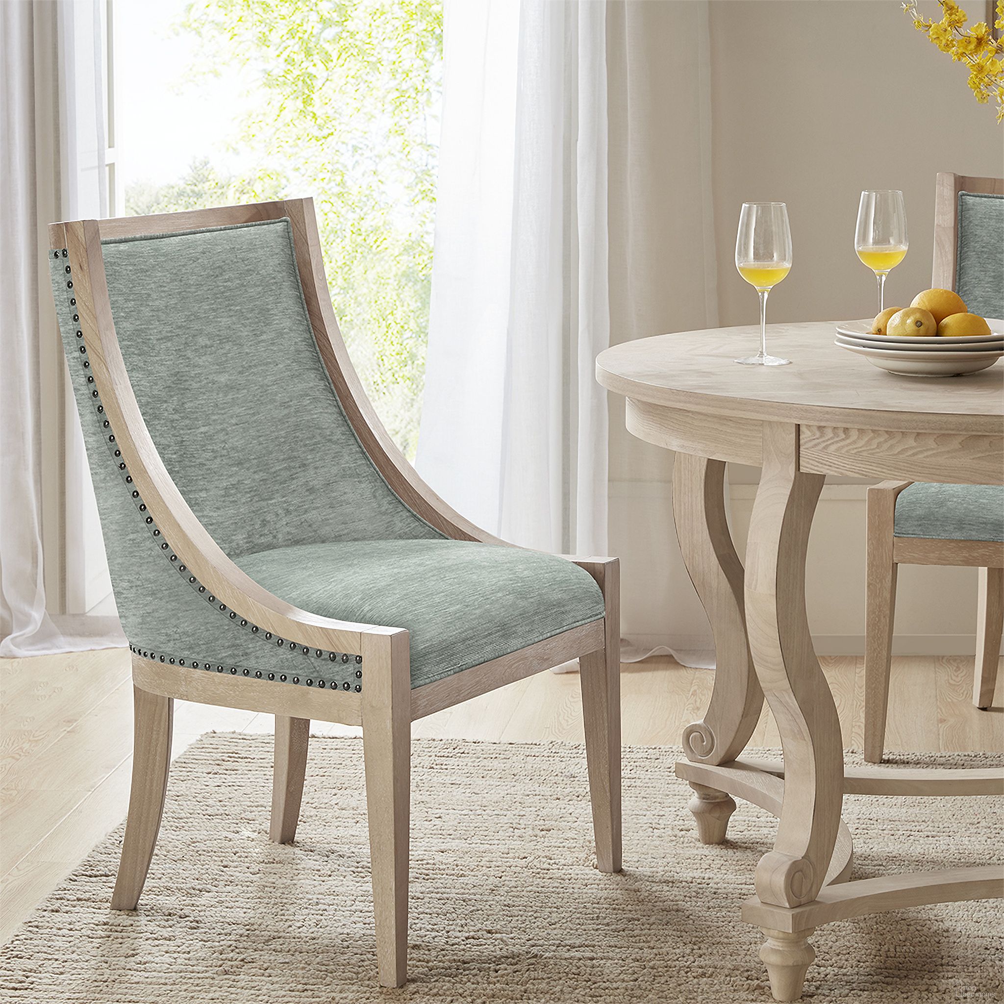 The appearance of Elmcrest Upholstered Dining Chair with Nailhead Trim In Soft Green designed by Martha Stewart in the country / farmhouse interior design. This soft green piece of furniture was selected by 1StopBedrooms from Elmcrest Collection to add a touch of cosiness and style into your home. Sku: MT108-0158. Material: Wood. Chair Type: Side Chair.