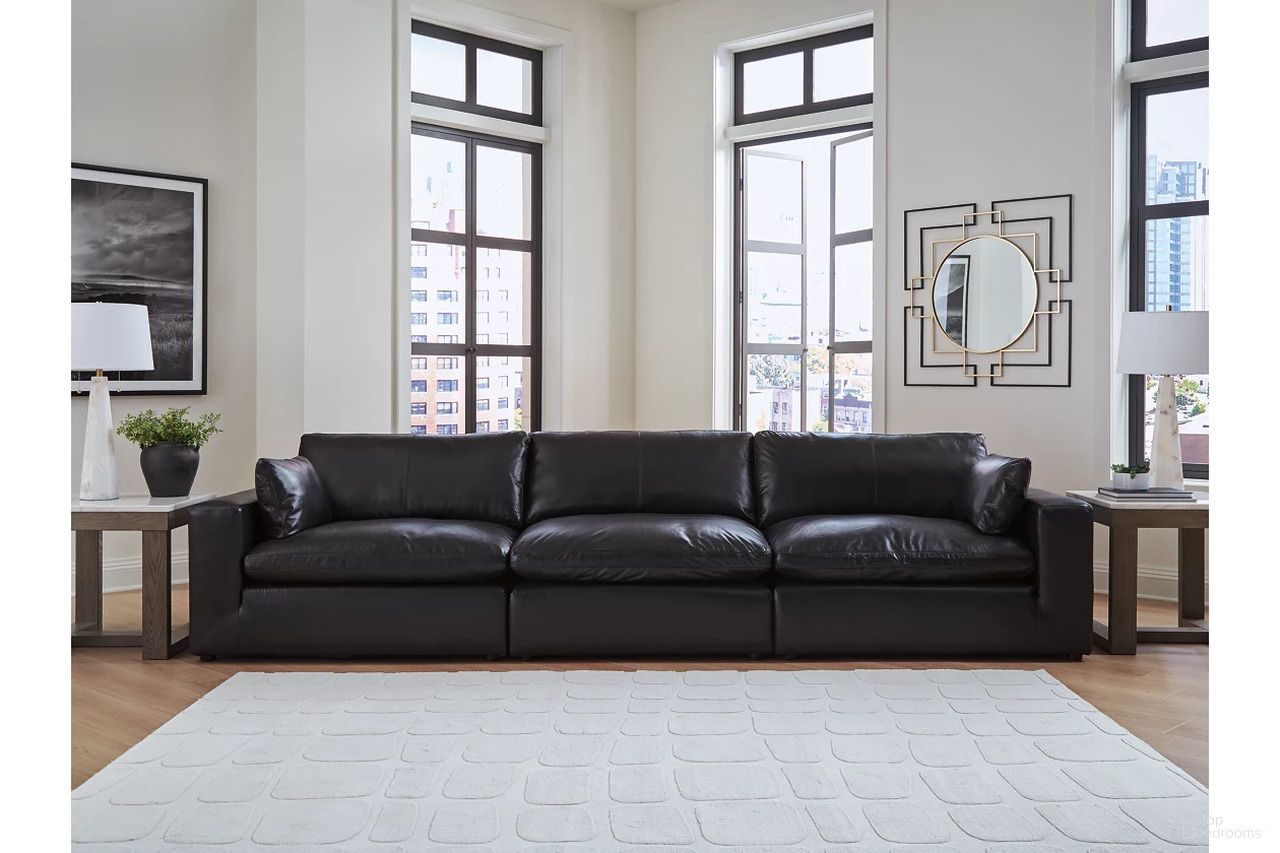 The appearance of Emilia Sofa In Black designed by Signature Design by Ashley in the modern / contemporary interior design. This black piece of furniture was selected by 1StopBedrooms from Emilia Collection to add a touch of cosiness and style into your home. Sku: 3090246;3090264;3090265. Material: Faux Leather.