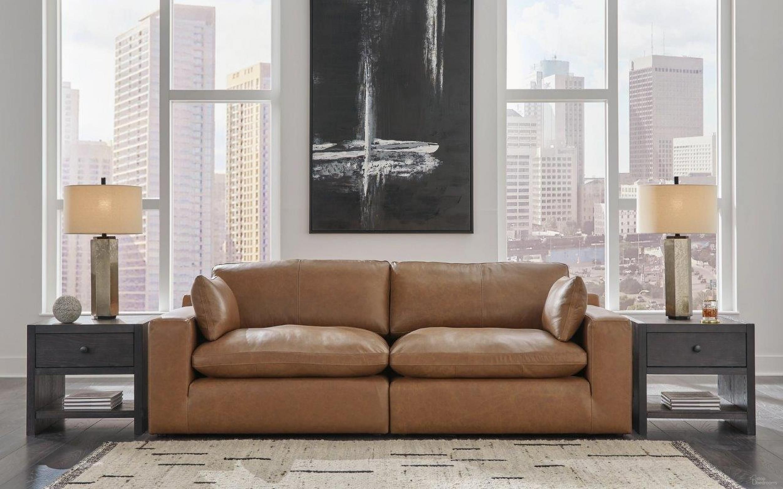 The appearance of Emilia Loveseat In Caramel designed by Signature Design by Ashley in the modern / contemporary interior design. This caramel piece of furniture was selected by 1StopBedrooms from Emilia Collection to add a touch of cosiness and style into your home. Sku: 3090164;3090165. Material: Leather Match.