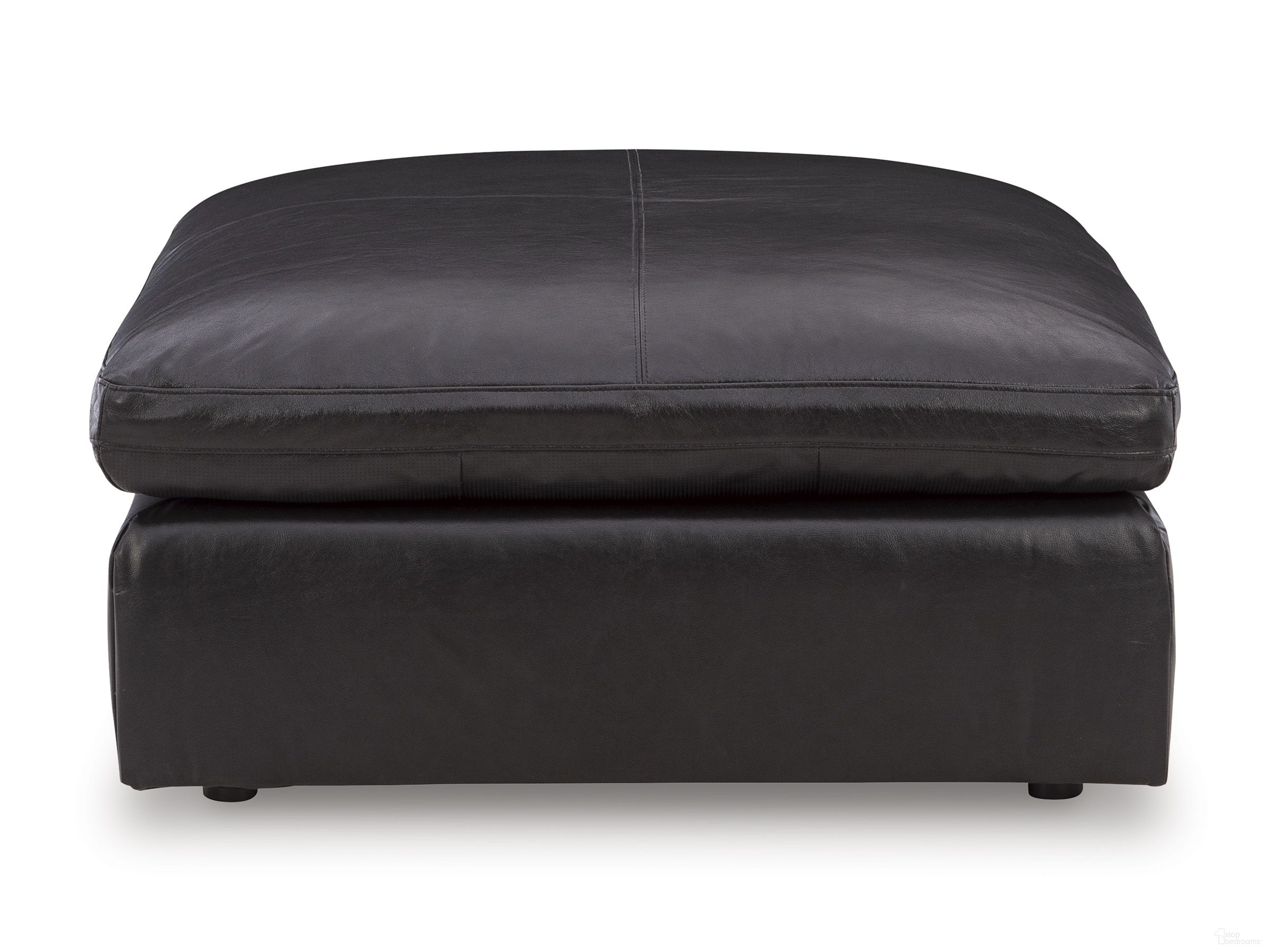 The appearance of Emilia Oversized Accent Ottoman In Black designed by Signature Design by Ashley in the modern / contemporary interior design. This black piece of furniture  was selected by 1StopBedrooms from Emilia Collection to add a touch of cosiness and style into your home. Sku: 3090208. Material: Faux Leather.