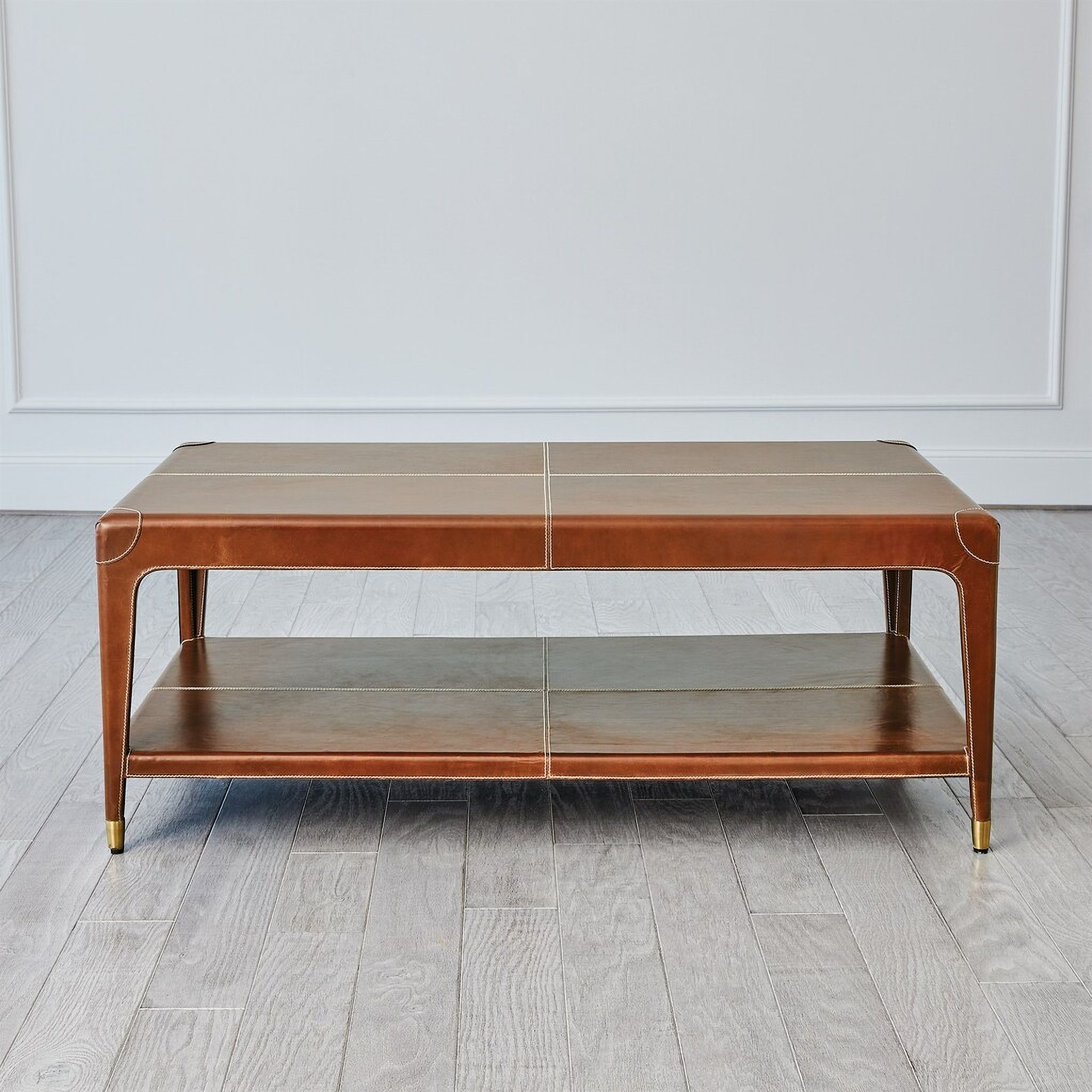 The appearance of Emporium Home Tiburtina Cocktail Table In Saddle designed by Global Views in the modern / contemporary interior design. This saddle piece of furniture  was selected by 1StopBedrooms from Emporium Home Collection to add a touch of cosiness and style into your home. Sku: WDSEH9240-GV. Material: Wood.