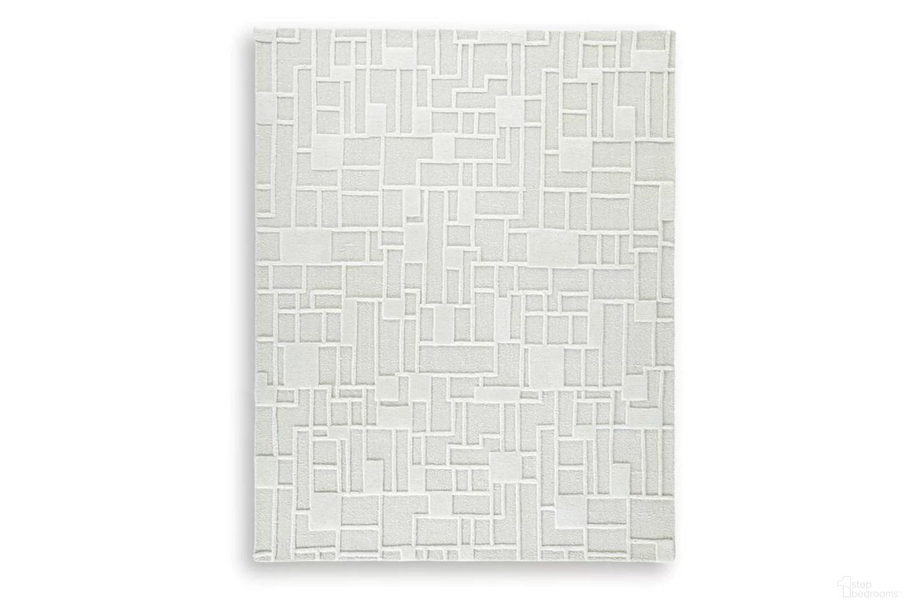 The appearance of Empriss 7'8" x 10' Area Rug In Ivory designed by Signature Design by Ashley in the transitional interior design. This ivory piece of furniture was selected by 1StopBedrooms from Empriss Collection to add a touch of cosiness and style into your home. Sku: R407621. Material: Cotton.