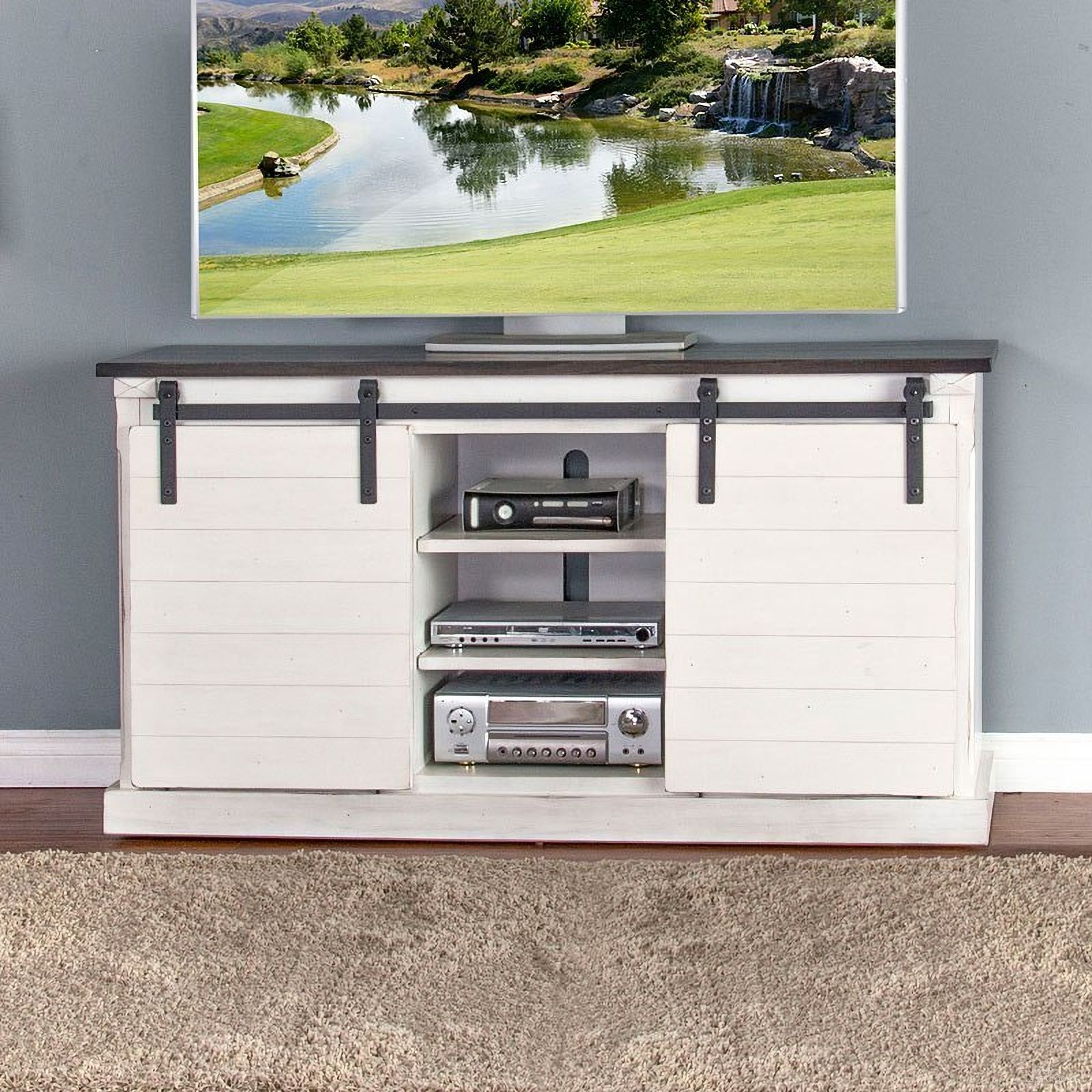 The appearance of European Cottage Barn Door 65 Inch TV Console designed by Sunny Designs in the country / farmhouse interior design. This european cottage piece of furniture  was selected by 1StopBedrooms from Carriage House Collection to add a touch of cosiness and style into your home. Sku: 3577EC-2. Material: Solid Wood.