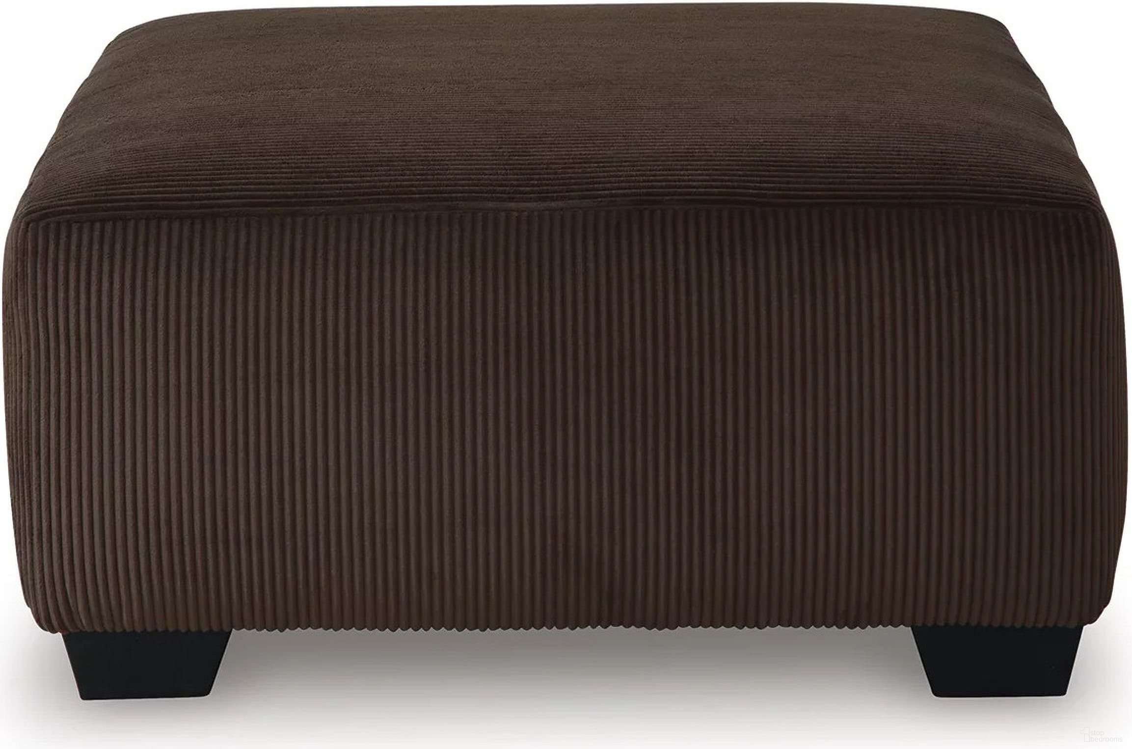 The appearance of Firescrest Oversized Accent Ottoman In Chocolate designed by Signature Design by Ashley in the modern / contemporary interior design. This chocolate piece of furniture  was selected by 1StopBedrooms from Firescrest Collection to add a touch of cosiness and style into your home. Sku: NC3560308. Material: Polyester.