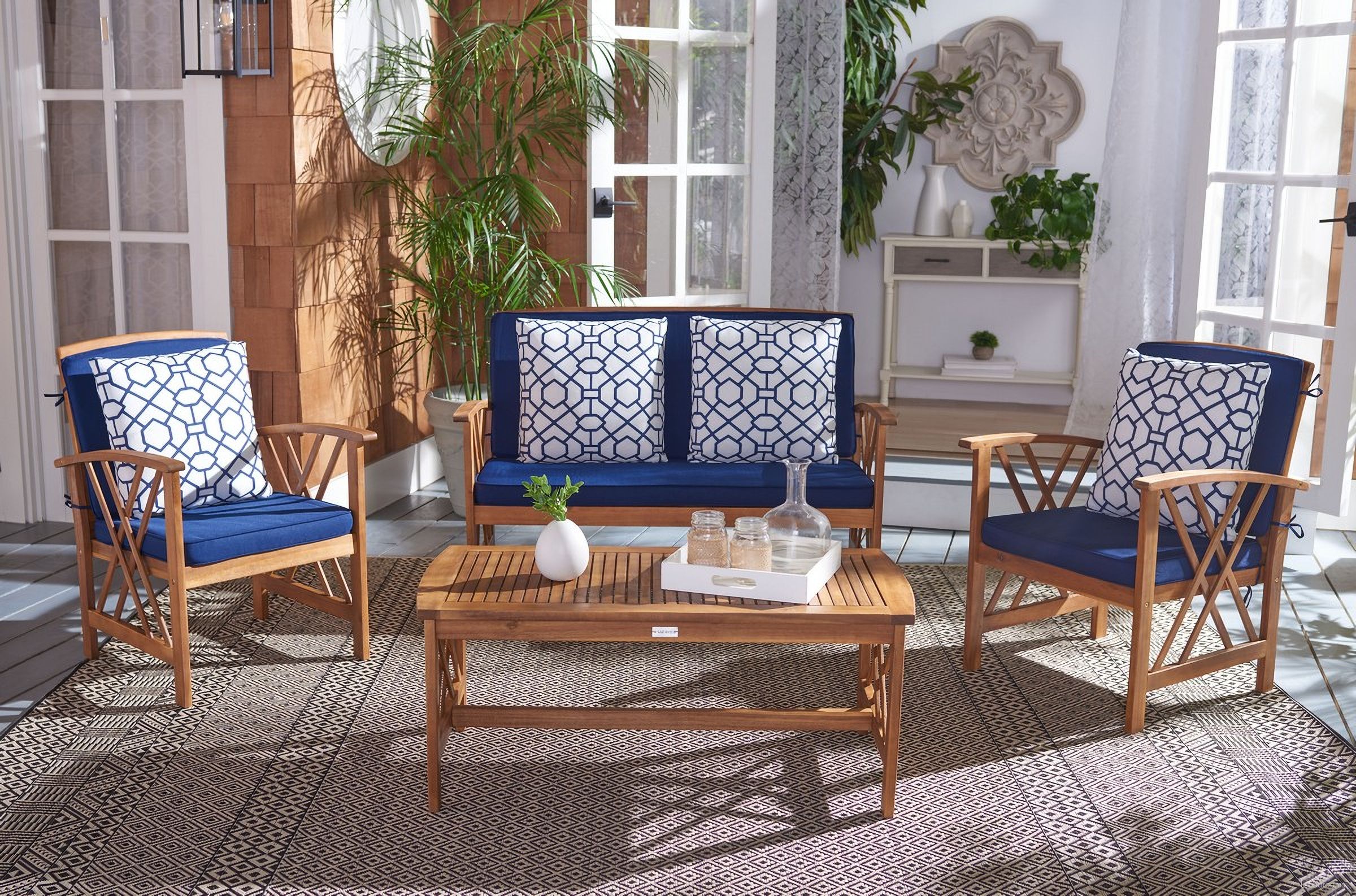 The appearance of Fontana 4 Piece Outdoor Set In Navy designed by Safavieh in the transitional interior design. This navy piece of furniture was selected by 1StopBedrooms from Fontana Collection to add a touch of cosiness and style into your home. Sku: PAT7008J. Material: Wood.