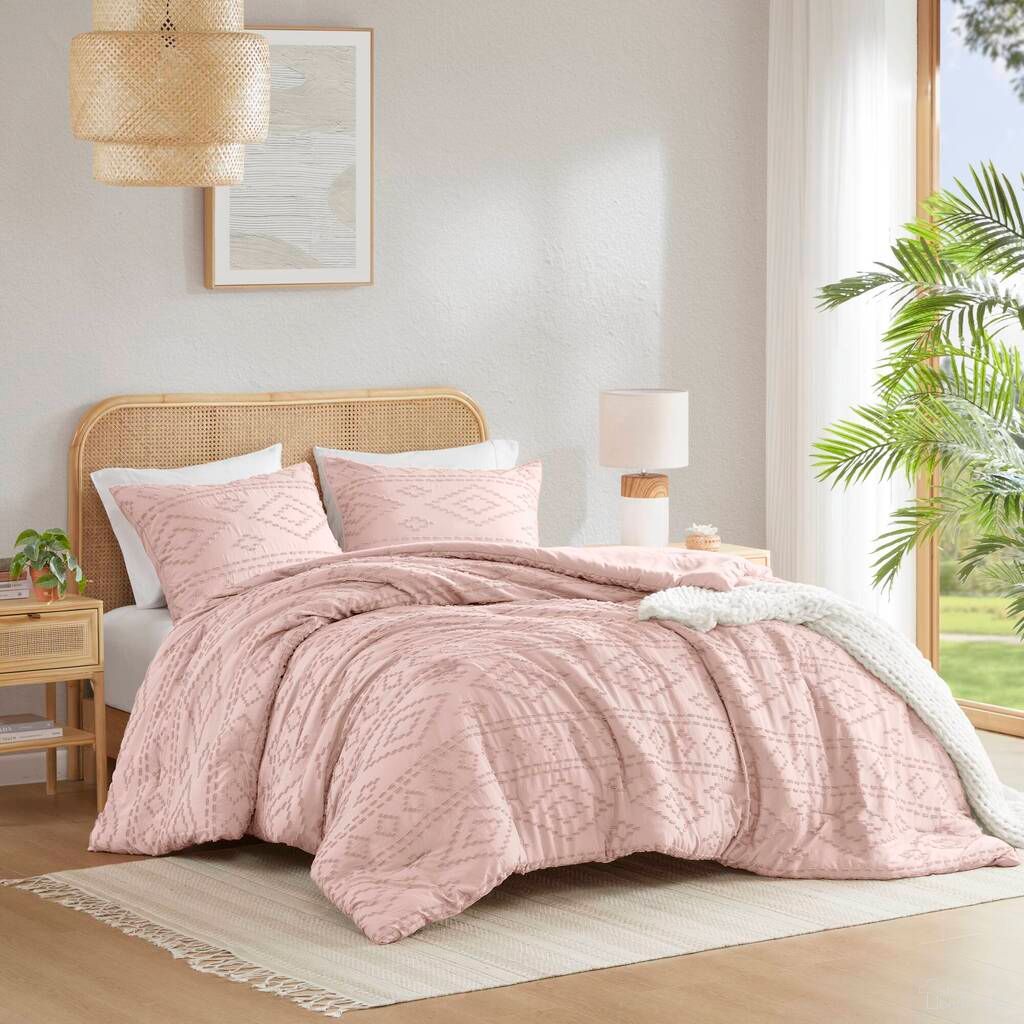 The appearance of Gigi Comforter Mini Set In Pink designed by Olliix in the modern / contemporary interior design. This pink piece of furniture  was selected by 1StopBedrooms from Gigi Collection to add a touch of cosiness and style into your home. Sku: AM10-0548. Material: Polyester. Bed Size: Full.