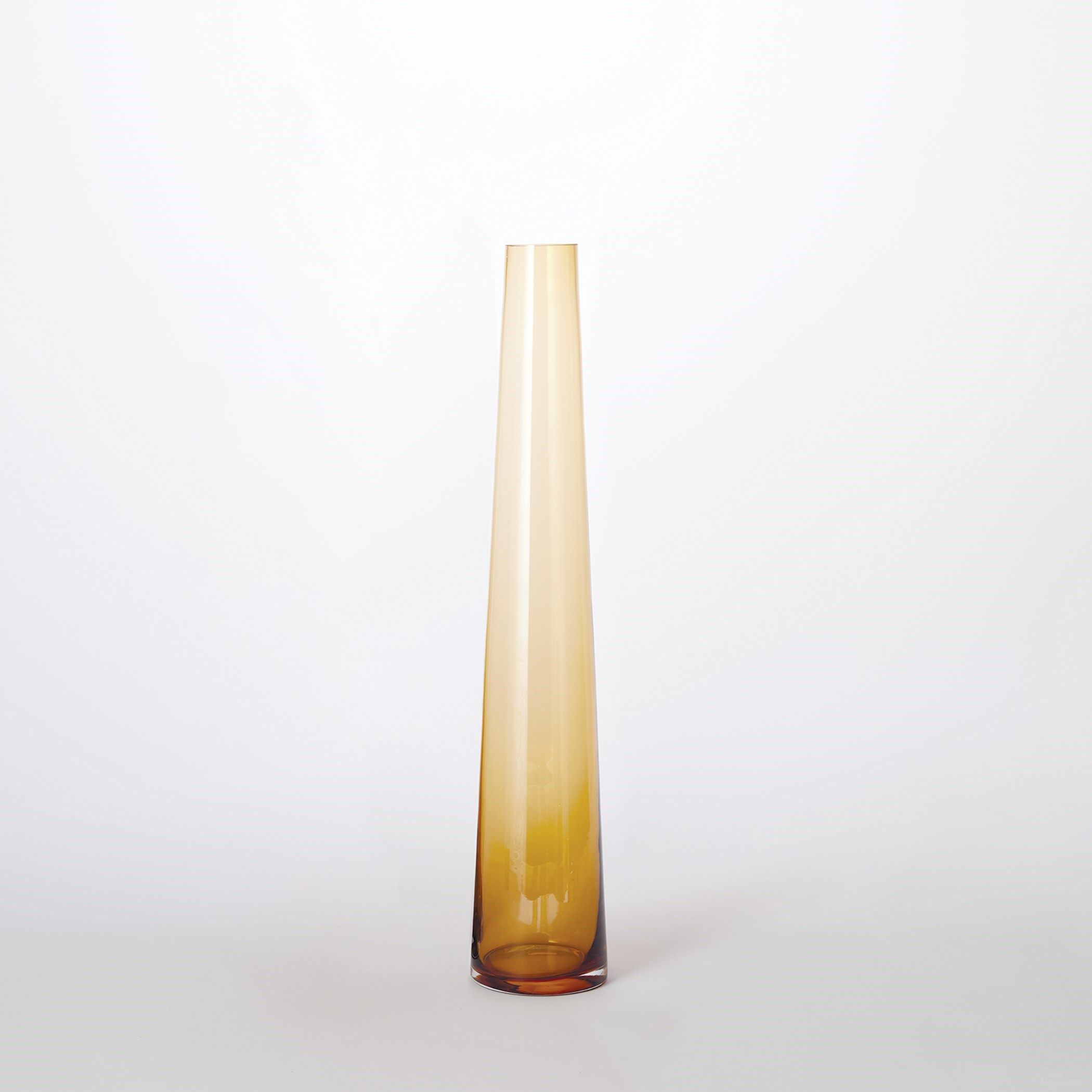 The appearance of Glass Tower Small Vase In Amber designed by Global Views in the modern / contemporary interior design. This brown piece of furniture was selected by 1StopBedrooms from Glass Collection to add a touch of cosiness and style into your home. Sku: 760228. Material: Glass.