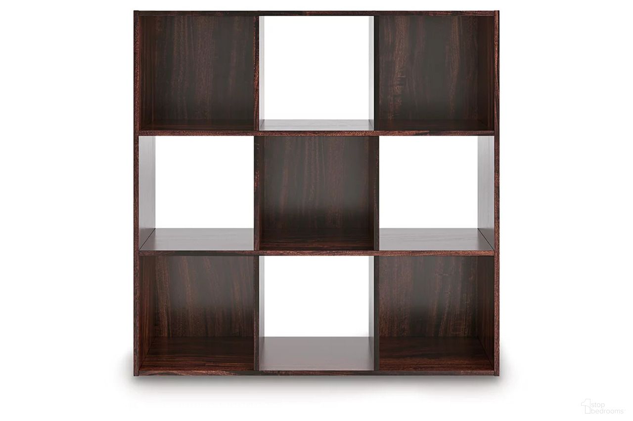 The appearance of Glosmount Nine Cube Organizer In Cherry and Light Brown designed by Signature Design by Ashley in the traditional interior design. This cherry and light brown piece of furniture  was selected by 1StopBedrooms from Glosmount Collection to add a touch of cosiness and style into your home. Sku: EA1055-3X3. Material: Wood.
