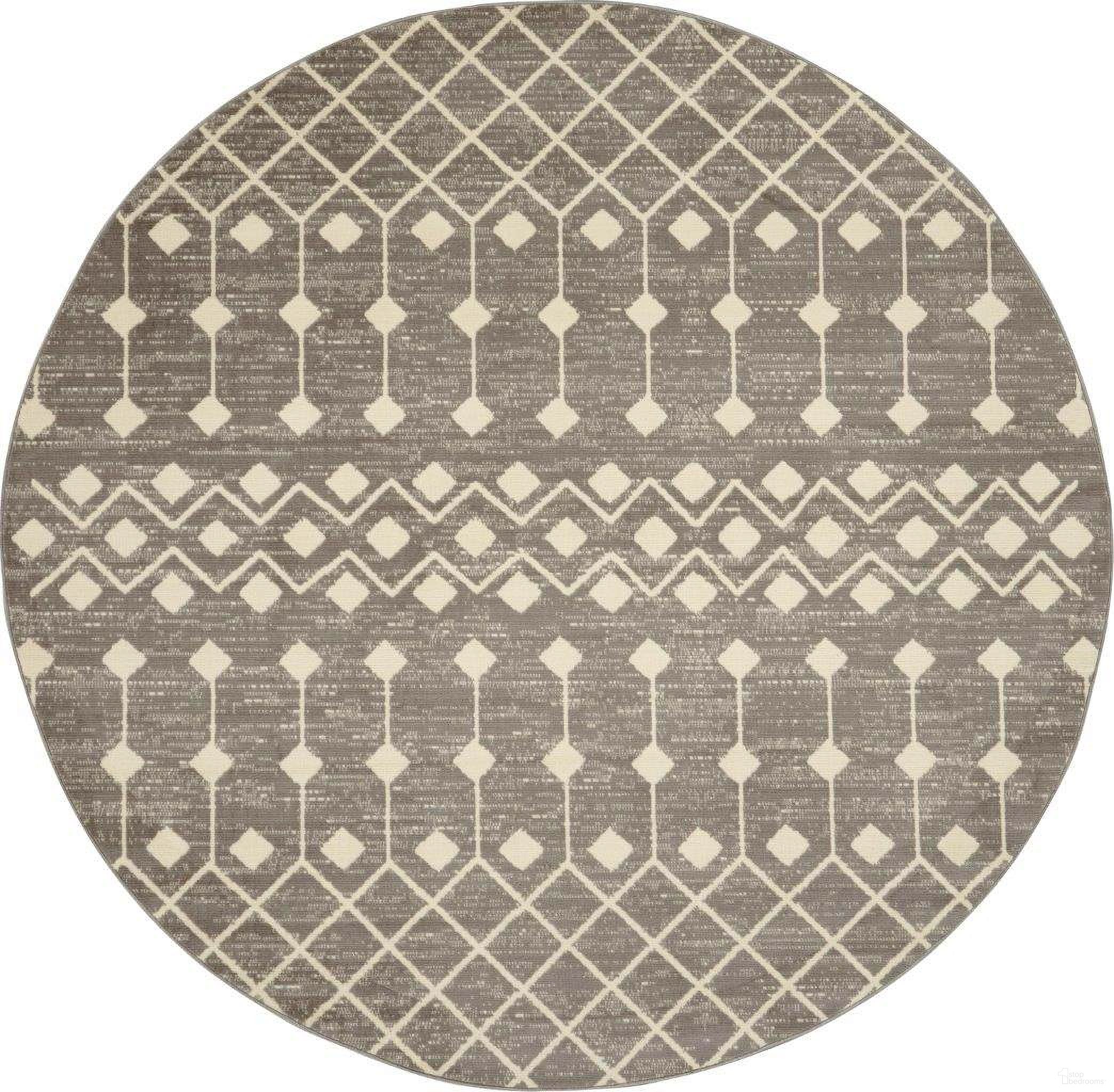 The appearance of Grafix Grey 5'3" x 5'3" Round Bohemian Area Rug designed by Nourison in the bohemian interior design. This grey piece of furniture was selected by 1StopBedrooms from Grafix Collection to add a touch of cosiness and style into your home. Sku: 99446753045. Material: Polypropylene.