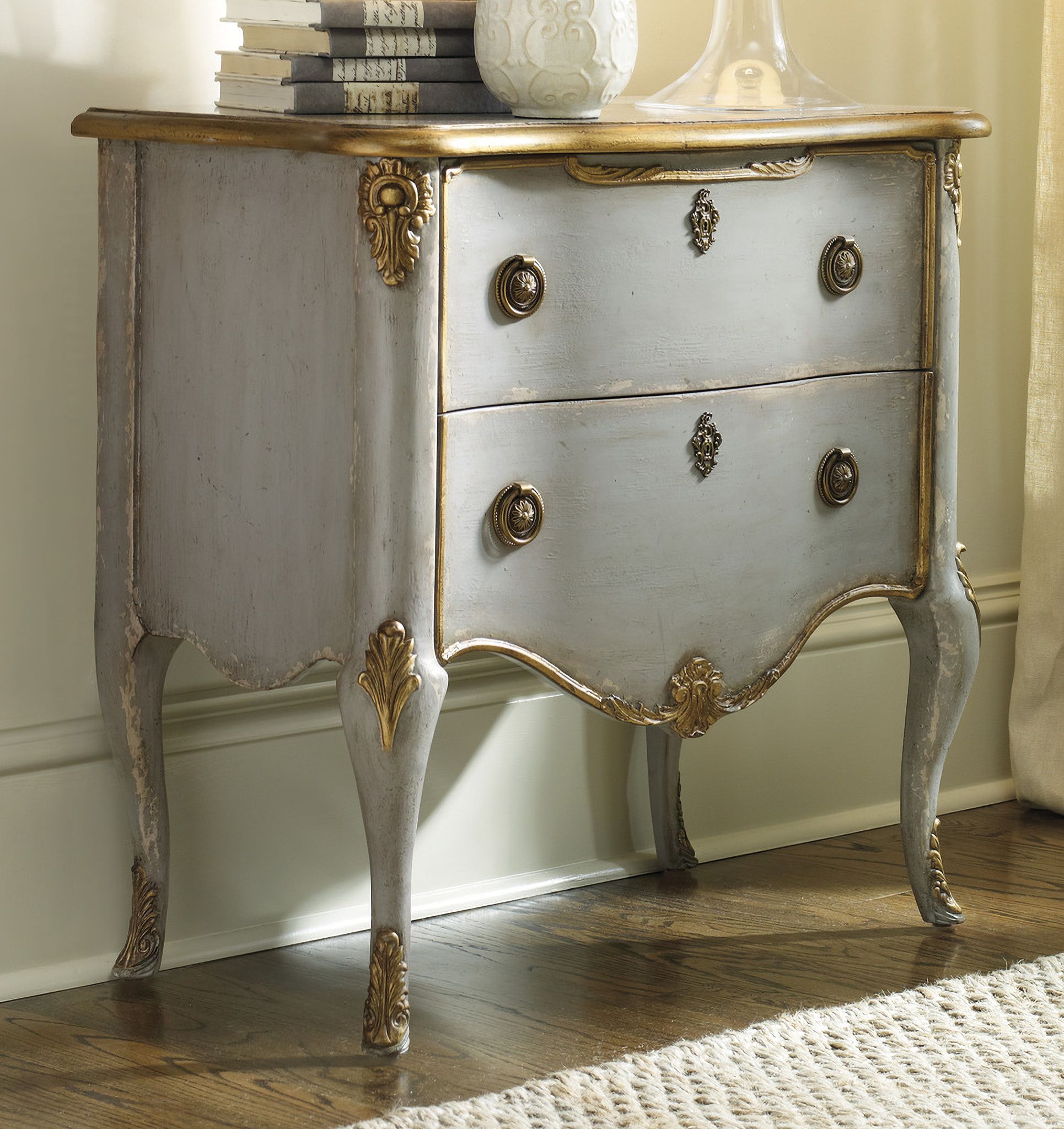The appearance of Melange Gray French 2 Drawer Chest designed by Hooker in the traditional interior design. This gray piece of furniture was selected by 1StopBedrooms from Melange Collection to add a touch of cosiness and style into your home. Sku: 500-50-887. Material: Hardwood.