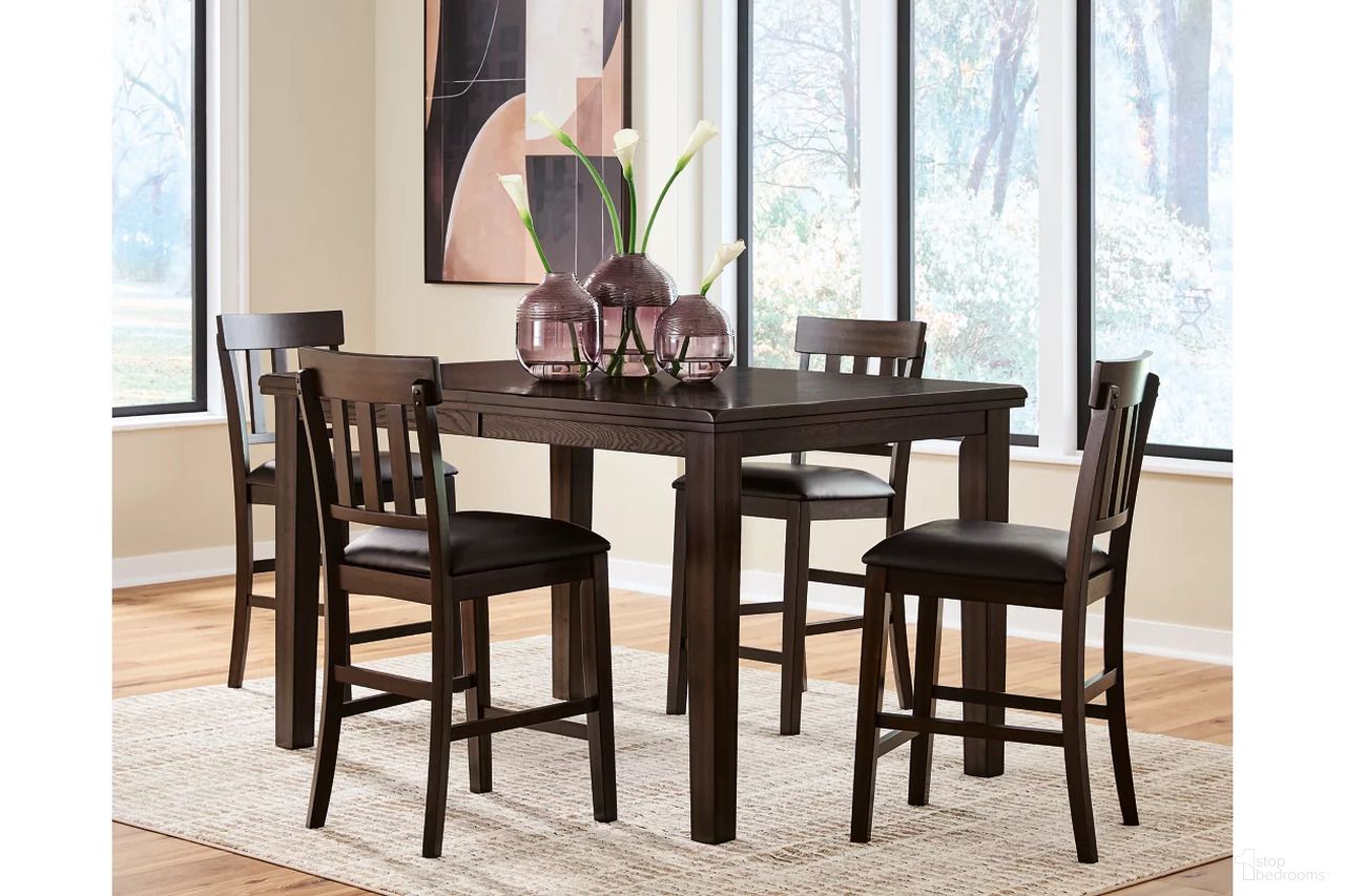 The appearance of Haddigan Counter Height Dining Room Set In Dark Brown designed by Signature Design by Ashley in the transitional interior design. This dark brown piece of furniture was selected by 1StopBedrooms from Haddigan Collection to add a touch of cosiness and style into your home. Sku: D596-32;D596-124;D596-124. Table Base Style: Legs. Material: Leather Match. Table Top Shape: Rectangular.
