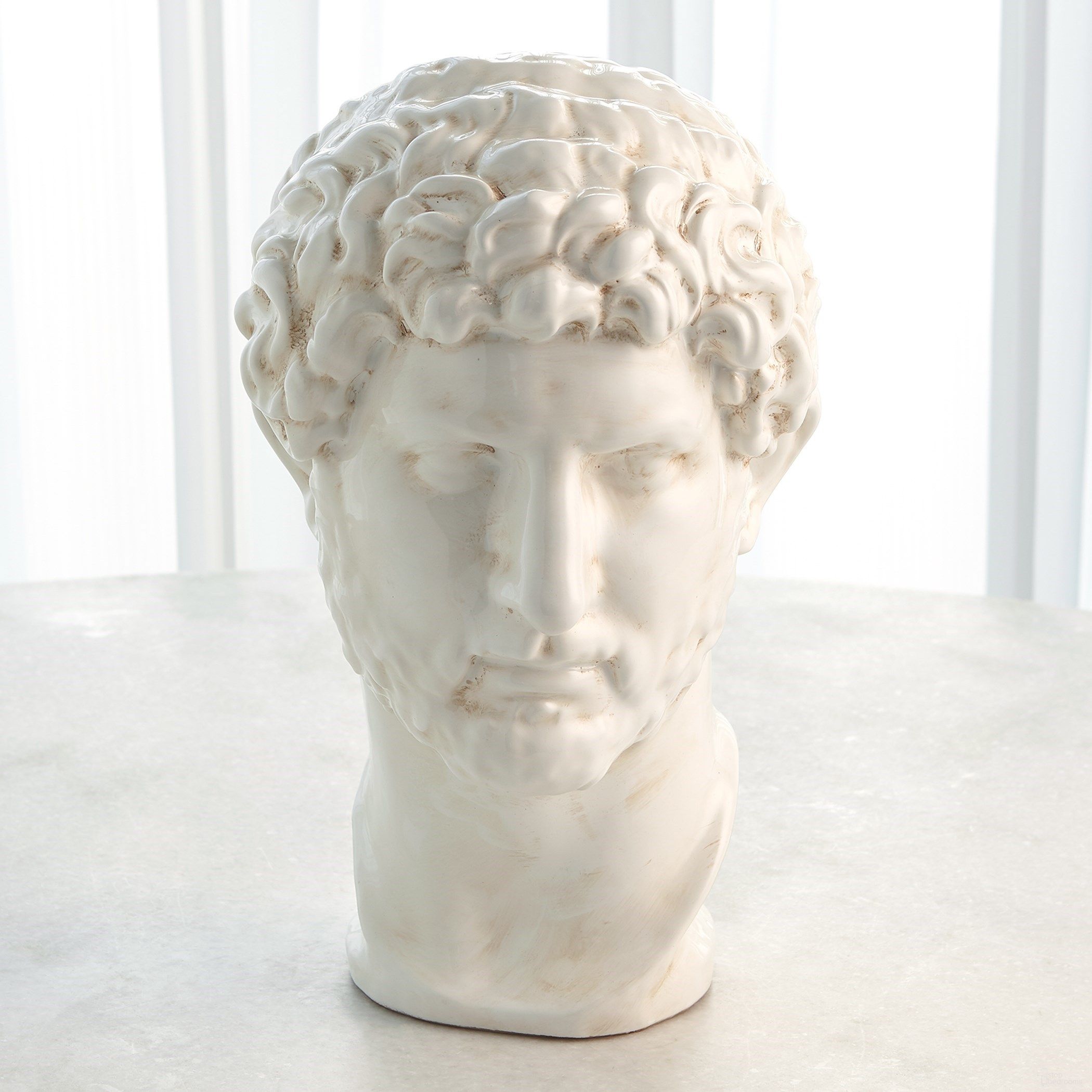 The appearance of Hadrian Bust In White Glaze designed by Global Views in the modern / contemporary interior design. This white piece of furniture was selected by 1StopBedrooms from Hadrian Collection to add a touch of cosiness and style into your home. Sku: 331687. Material: Ceramic.