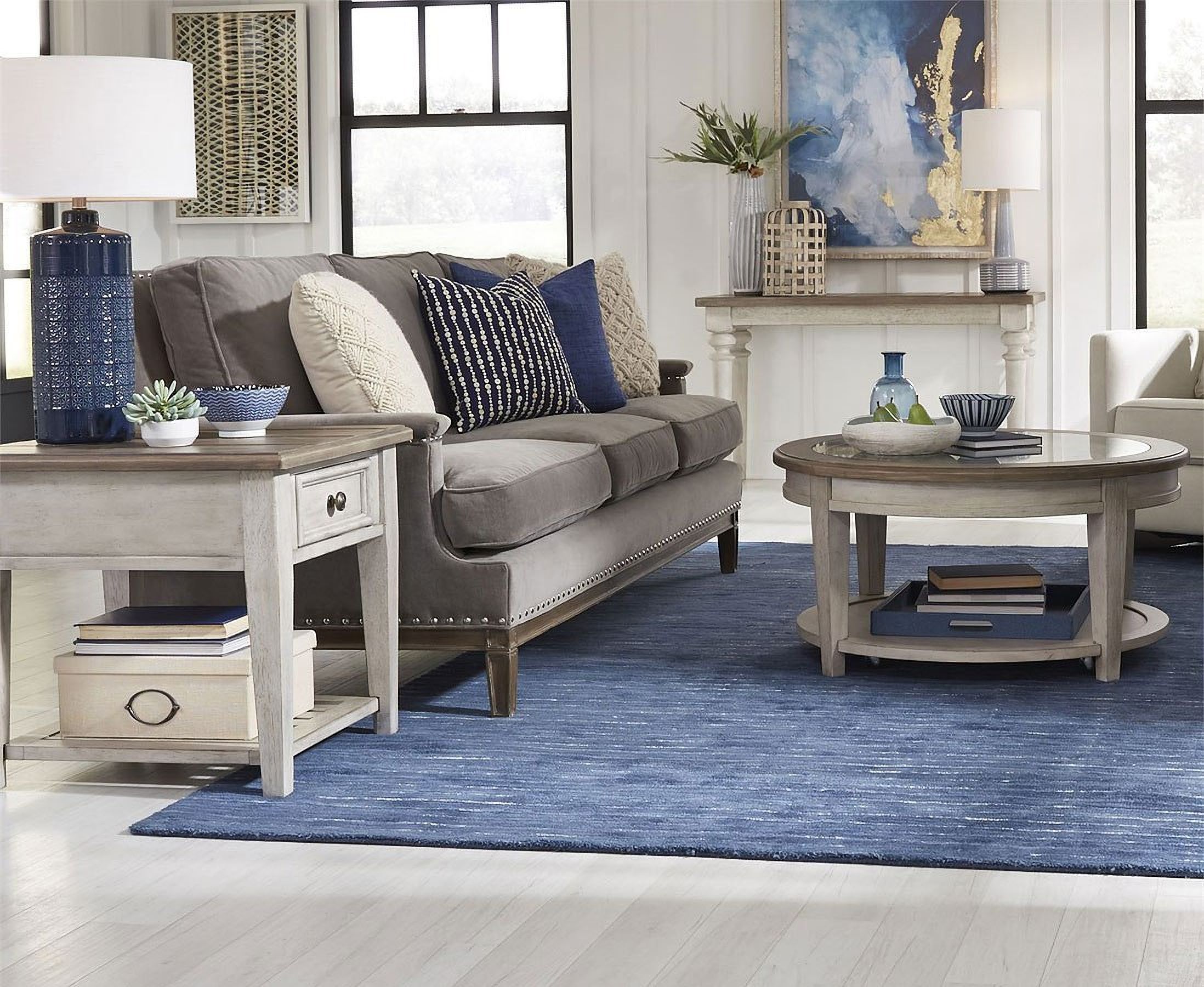 The appearance of Heartland Round Ceiling Tile Occasional Table Set designed by Liberty in the country / farmhouse interior design. This antique white piece of furniture was selected by 1StopBedrooms from Heartland Collection to add a touch of cosiness and style into your home. Sku: 824-OT1012;824-OT1020. Material: Rubberwood.
