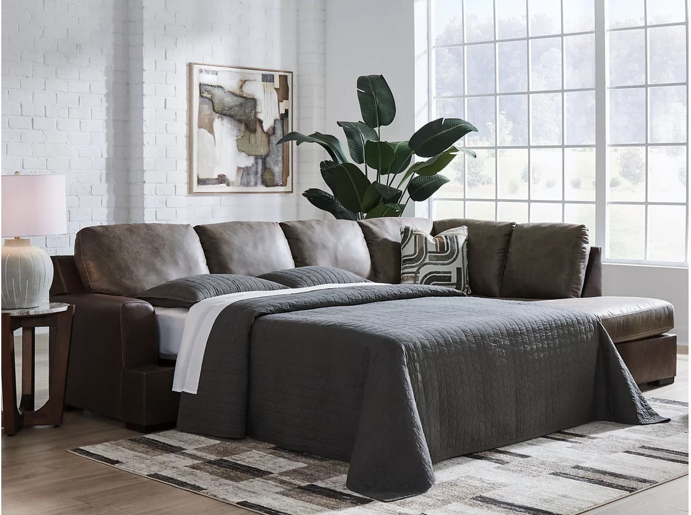 The appearance of Helson 2-Piece RAF Sleeper Sectional with Chaise In Fossil designed by Signature Design by Ashley in the modern / contemporary interior design. This fossil piece of furniture was selected by 1StopBedrooms from Helson Collection to add a touch of cosiness and style into your home. Sku: NC6270317;NC6270369. Material: Leather. Orientation: RAF.