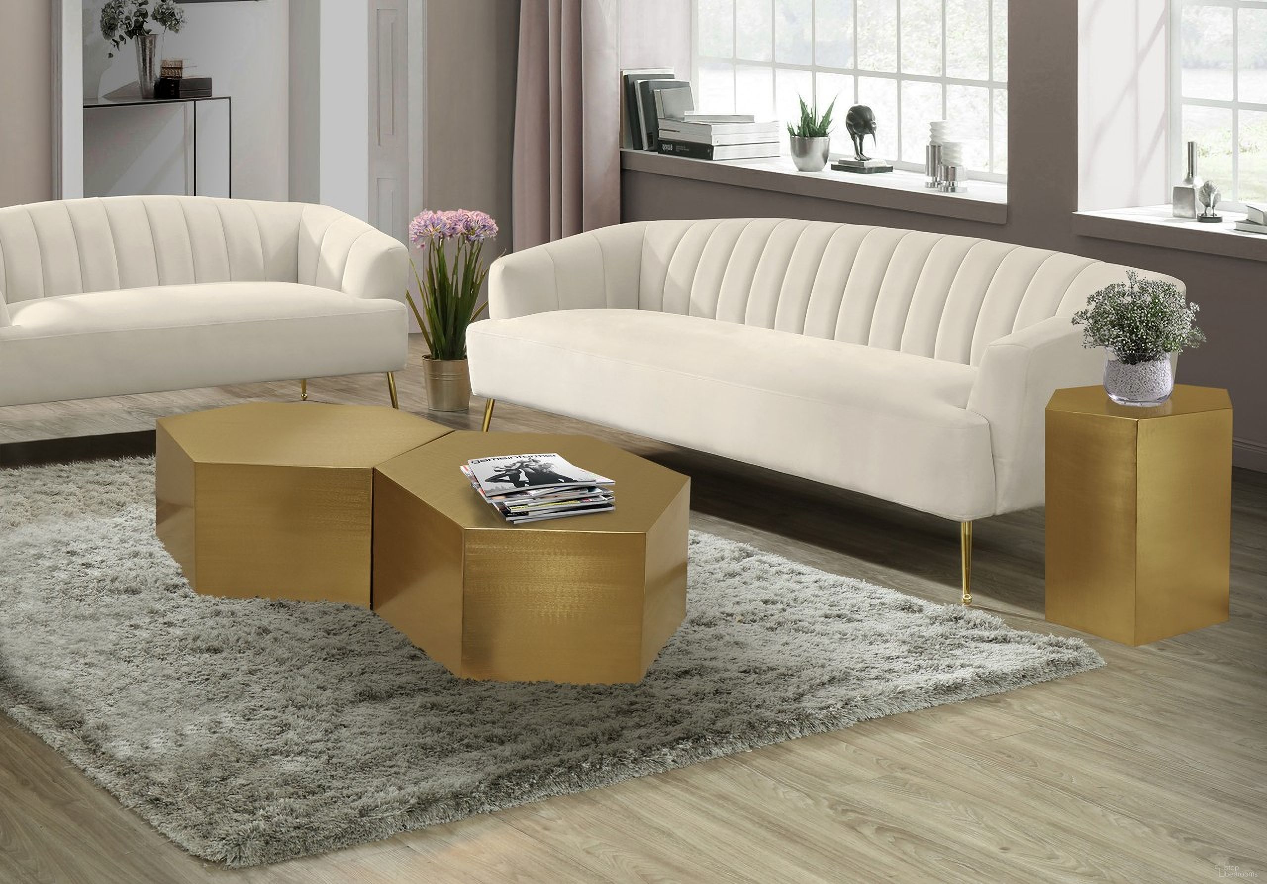 The appearance of Hexagon 2-Piece Occasional Table Set In Brushed Gold designed by Meridian in the modern / contemporary interior design. This brushed gold piece of furniture  was selected by 1StopBedrooms from Hexagon Collection to add a touch of cosiness and style into your home. Sku: 292-CT;292-CT;292-ET. Material: Iron.