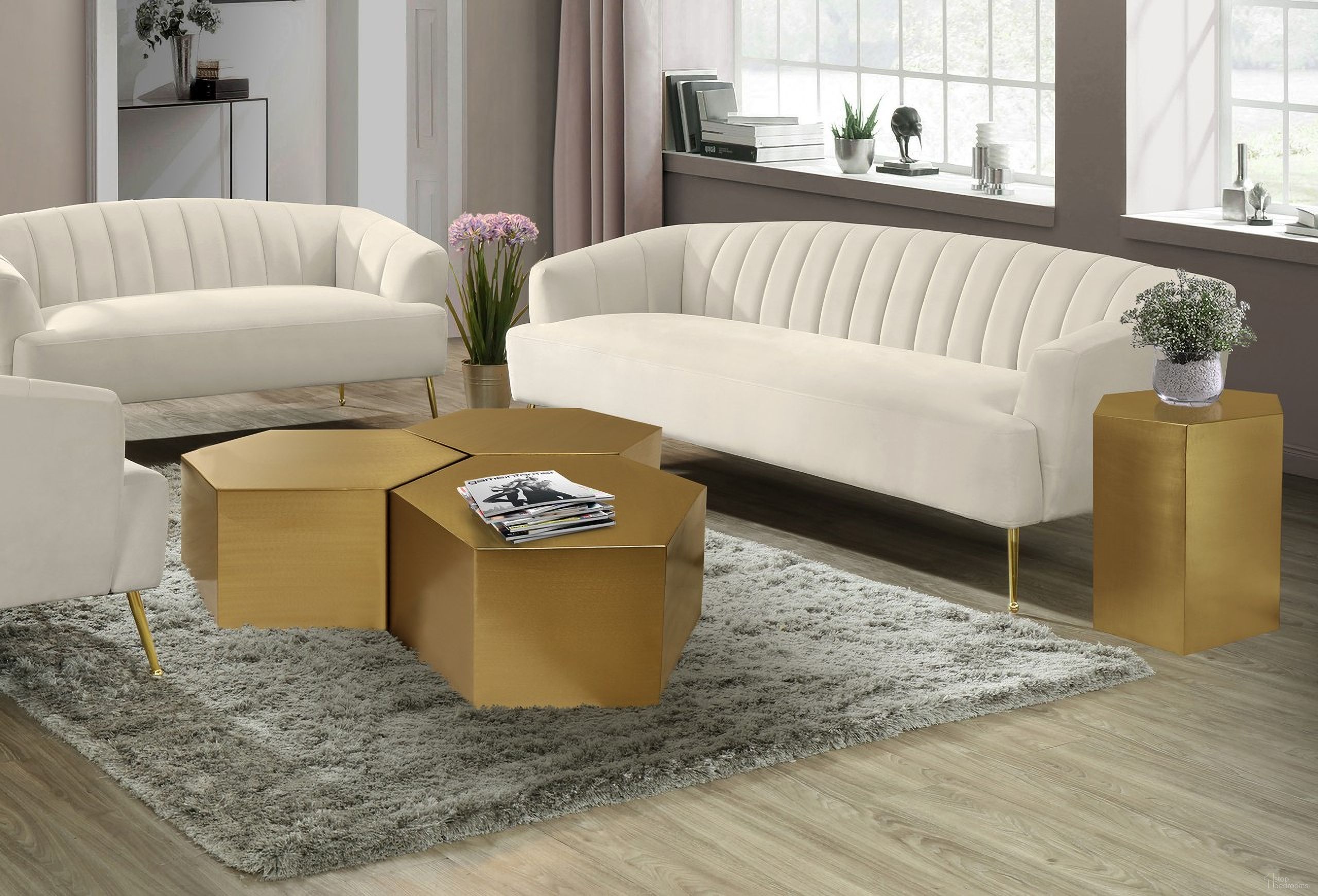 The appearance of Hexagon 3-Piece Occasional Table Set In Brushed Gold designed by Meridian in the modern / contemporary interior design. This brushed gold piece of furniture  was selected by 1StopBedrooms from Hexagon Collection to add a touch of cosiness and style into your home. Sku: 292-CT;292-CT;292-CT;292-ET. Material: Iron.