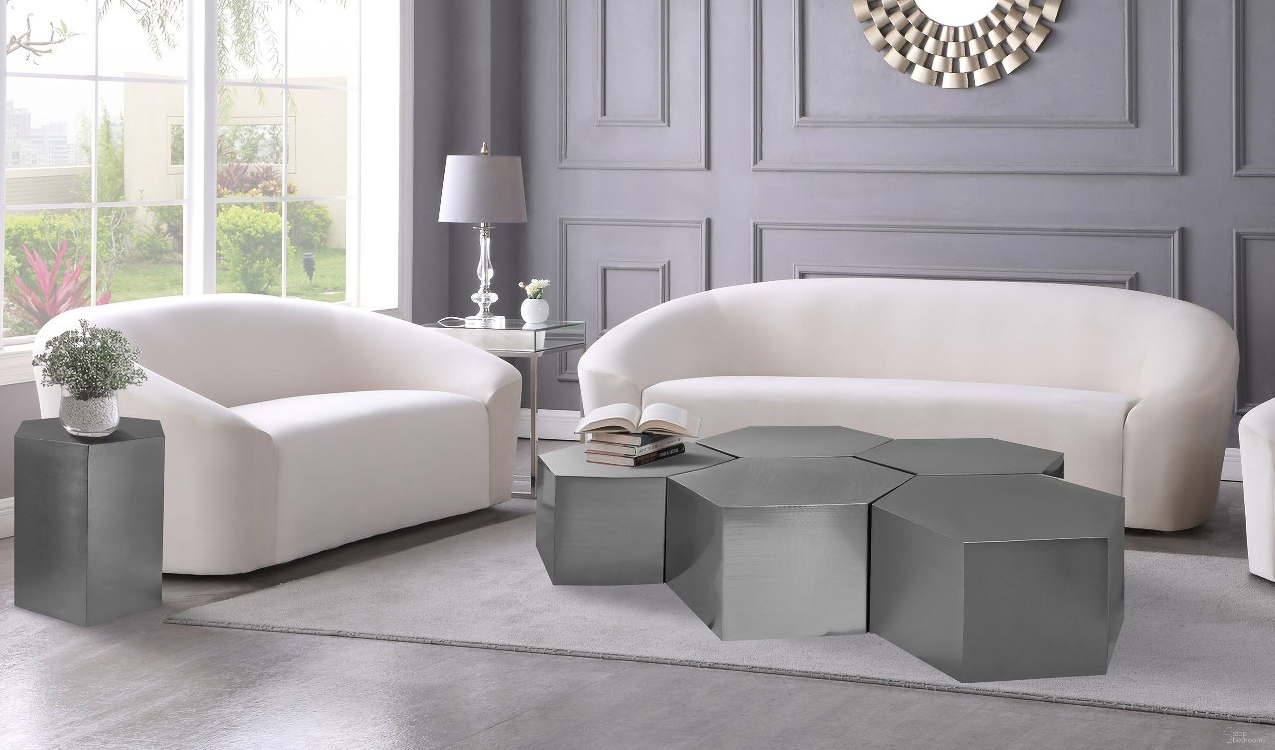 The appearance of Hexagon 5-Piece Occasional Table Set In Chrome designed by Meridian in the modern / contemporary interior design. This chrome piece of furniture  was selected by 1StopBedrooms from Hexagon Collection to add a touch of cosiness and style into your home. Sku: 293-CT;293-CT;293-CT;293-CT;293-CT;293-ET. Material: Iron.