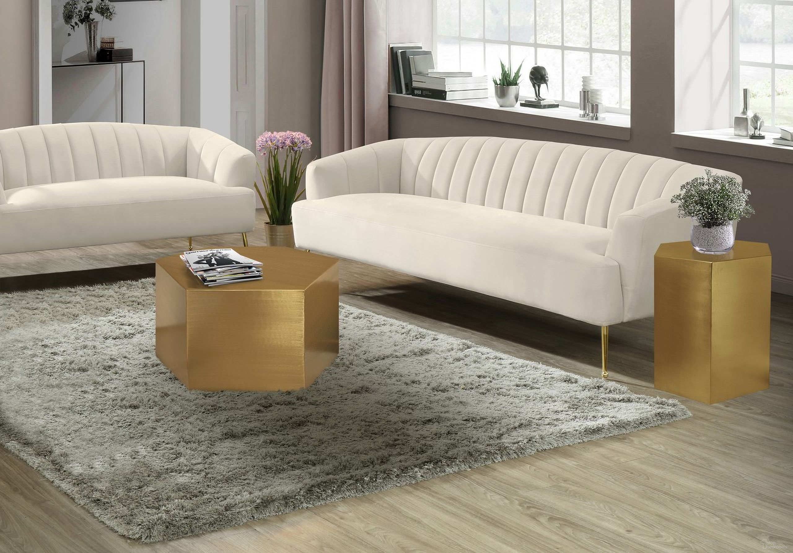 The appearance of Hexagon Occasional Table Set In Brushed Gold designed by Meridian in the modern / contemporary interior design. This brushed gold piece of furniture  was selected by 1StopBedrooms from Hexagon Collection to add a touch of cosiness and style into your home. Sku: 292-CT;292-ET. Material: Iron.