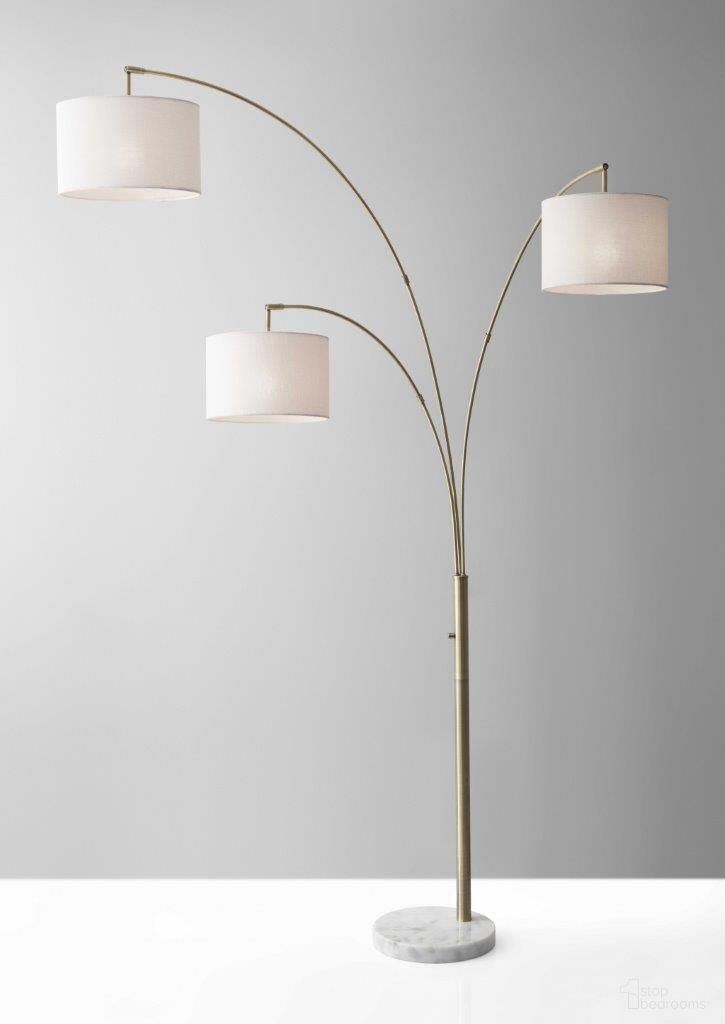 The appearance of Homeroots Brass Metal 3 Arm Arc Lamp 372712 designed by Homeroots in the transitional interior design. This brass piece of furniture  was selected by 1StopBedrooms from  to add a touch of cosiness and style into your home. Sku: 372712. Material: Metal.