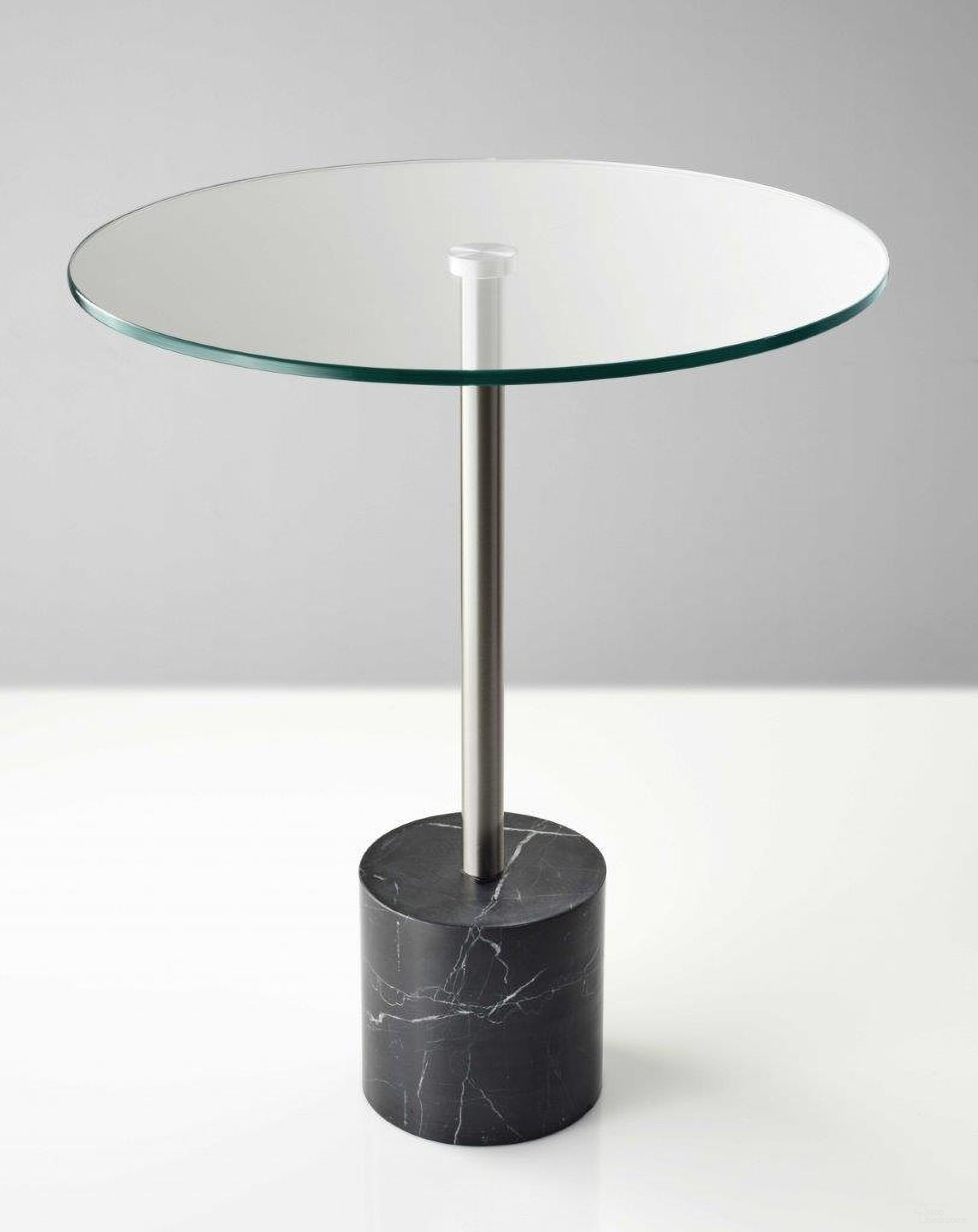 The appearance of Homeroots Brushed Steel Black Marble End Table designed by Homeroots in the modern / contemporary interior design. This black piece of furniture  was selected by 1StopBedrooms from  to add a touch of cosiness and style into your home. Sku: 372937. Material: Marble.