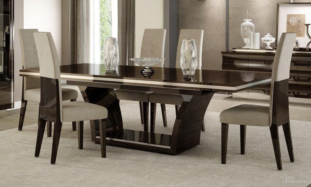 The appearance of Homeroots Modern Wenge High Gloss Dining Table 343994 designed by Homeroots in the modern / contemporary interior design. This wenge piece of furniture  was selected by 1StopBedrooms from  to add a touch of cosiness and style into your home. Sku: 343994. Table Base Style: Trestle. Table Top Shape: Rectangular. Size: 43" x 98". Material: Solid Wood.