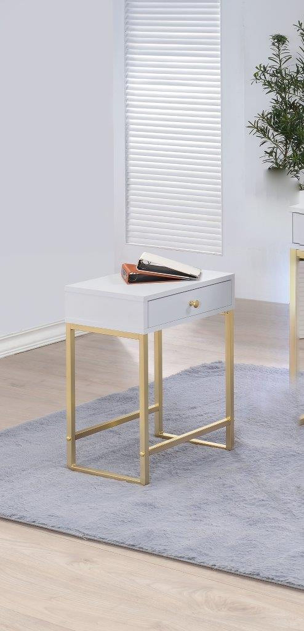 The appearance of Homeroots White And Brass Side Table designed by Homeroots in the traditional interior design. This white and brushed brass piece of furniture  was selected by 1StopBedrooms from  to add a touch of cosiness and style into your home. Sku: 286068. Material: Vinyl.