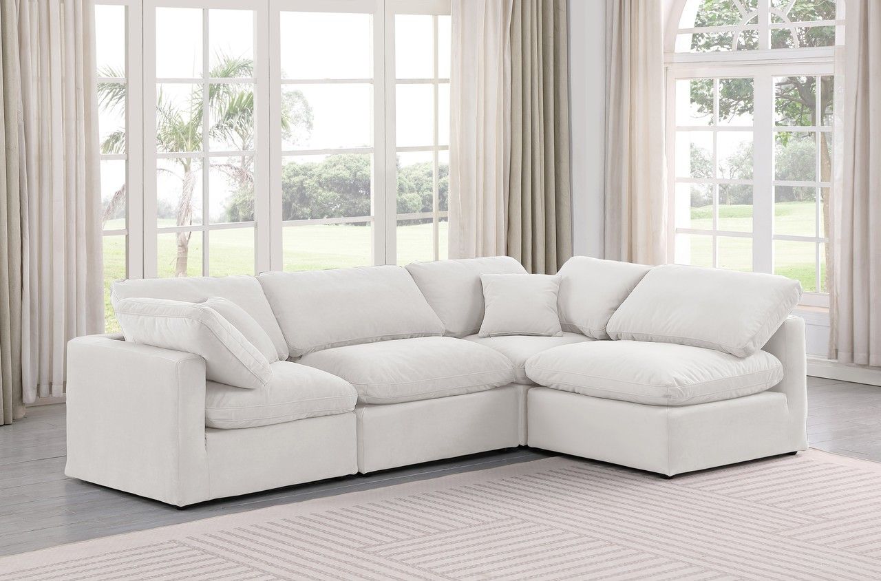 The appearance of Indulge 4 Piece Modular Sectional In Cream Velvet designed by Meridian in the modern / contemporary interior design. This cream velvet piece of furniture  was selected by 1StopBedrooms from Indulge Collection to add a touch of cosiness and style into your home. Sku: 147Cream-Armless;147Cream-Armless;147Cream-Corner;147Cream-Corner. Material: Velvet. Layout: L-Shape.