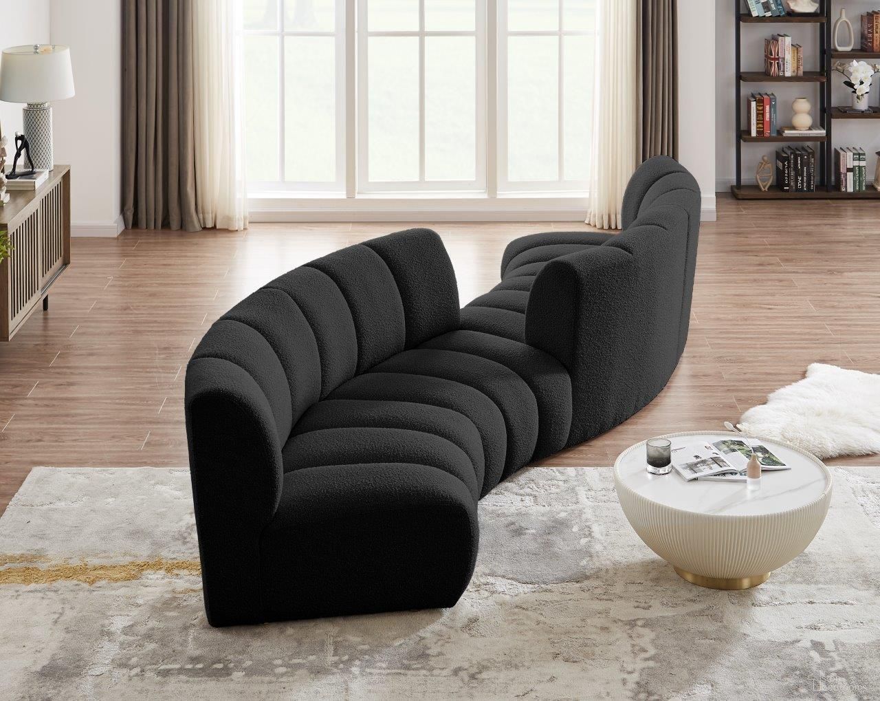 The appearance of Infinity 4-Piece Boucle Fabric Modular Sectional In Black designed by Meridian in the modern / contemporary interior design. This black piece of furniture was selected by 1StopBedrooms from Infinity Collection to add a touch of cosiness and style into your home. Sku: 643Black-C;643Black-C;643Black-C;643Black-C. Material: Wood. Layout: Curved.