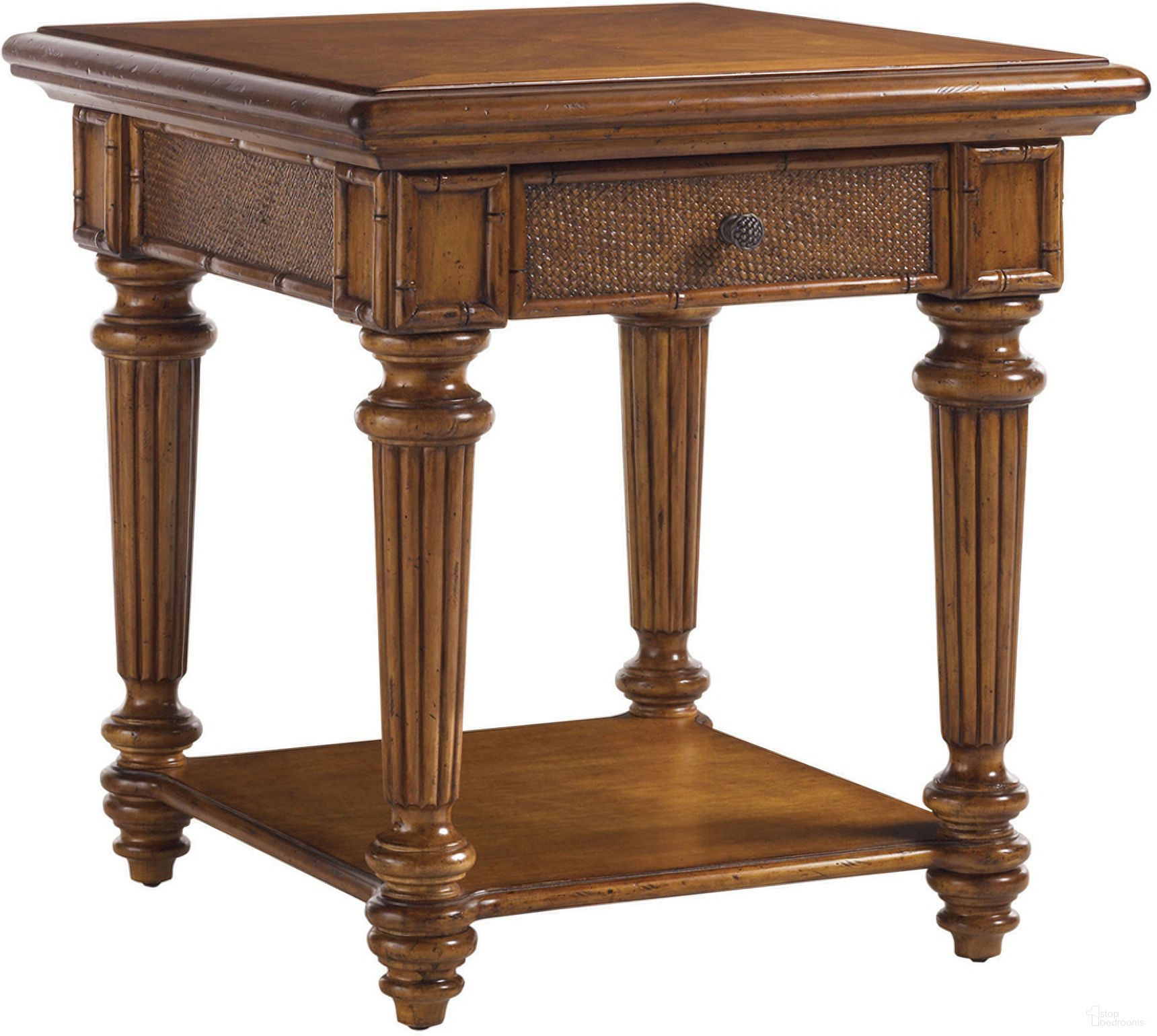 The appearance of Island Estate Boca End Table In Plantation designed by Tommy Bahama in the traditional interior design. This plantation piece of furniture was selected by 1StopBedrooms from Island Estate Collection to add a touch of cosiness and style into your home. Sku: 531-952. Material: Rattan.