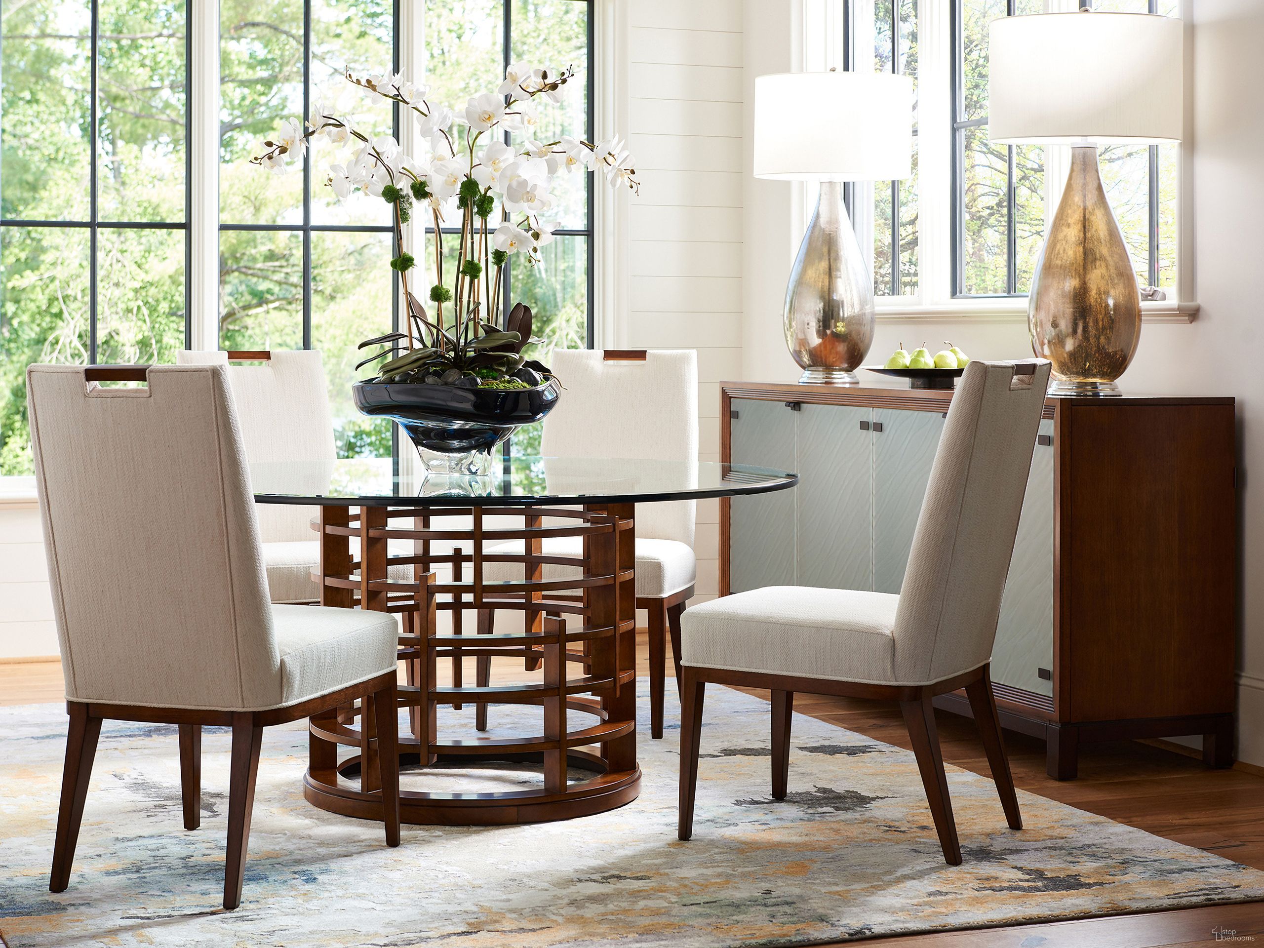 The appearance of Island Fusion Meridien Round Dining Table with 60 Inch Glass Top In Sebana designed by Tommy Bahama in the modern / contemporary interior design. This sebana piece of furniture was selected by 1StopBedrooms from Island Fusion Collection to add a touch of cosiness and style into your home. Sku: 556-875-60C. Table Base Style: Pedestal. Table Top Shape: Round. Material: Wood. Size: 60".