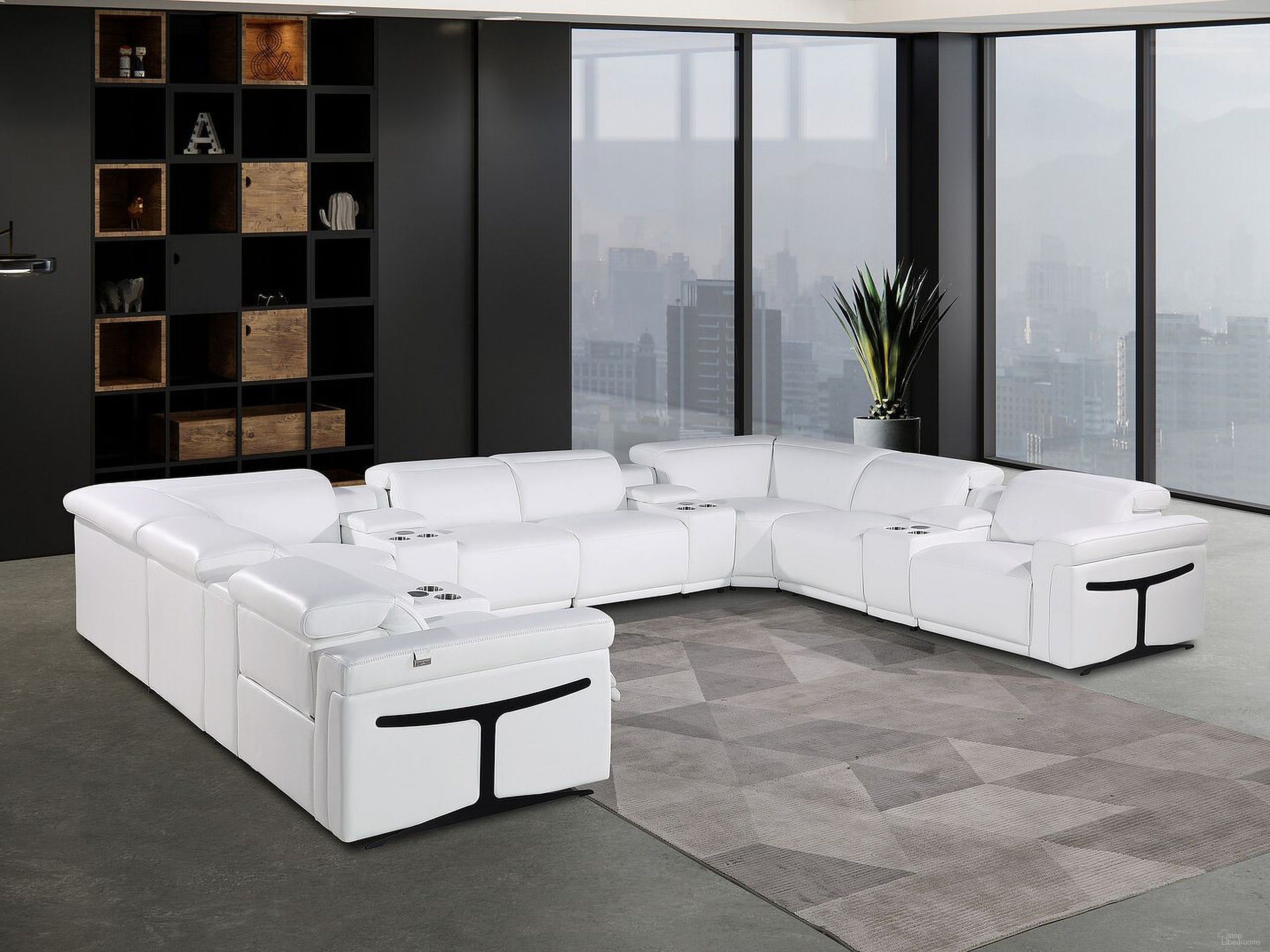 The appearance of Italian Leather Power Reclining U Shaped Twelve Piece Sectional with Console In White designed by Homeroots in the modern / contemporary interior design. This white piece of furniture  was selected by 1StopBedrooms from  to add a touch of cosiness and style into your home. Sku: 634656. Material: Leather.