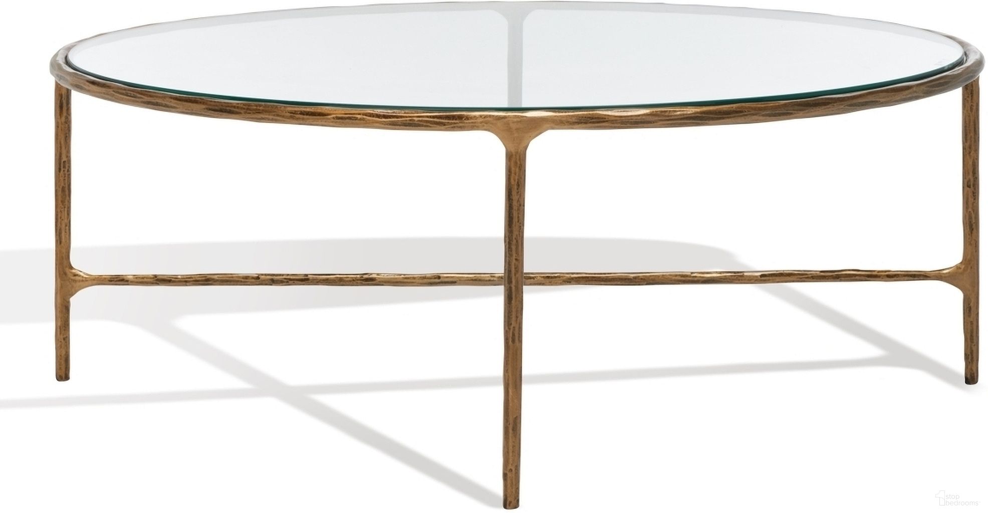 The appearance of Jessa Oval Metal Coffee Table In Brass designed by Safavieh Couture in the modern / contemporary interior design. This brass piece of furniture  was selected by 1StopBedrooms from Jessa Collection to add a touch of cosiness and style into your home. Sku: SFV9521A. Material: Iron.