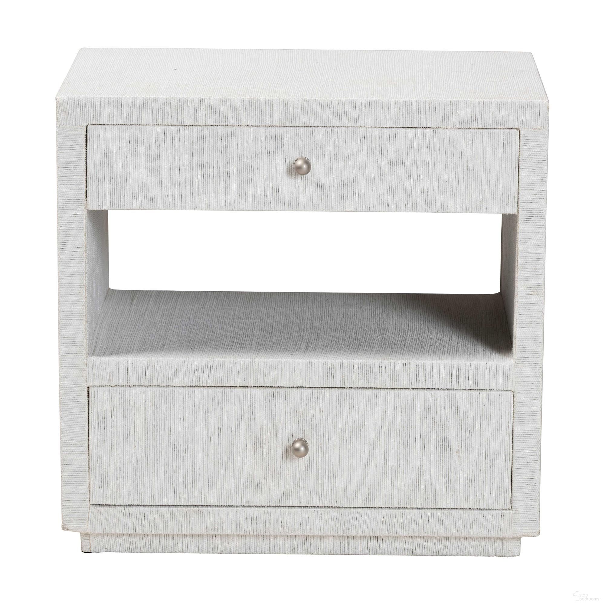 The appearance of Kai 2-Drawer Grasscloth End Table In White designed by Baxton Studio in the bohemian interior design. This white piece of furniture  was selected by 1StopBedrooms from Kai Collection to add a touch of cosiness and style into your home. Sku: KAI-2 Drawer-White-End Table. Material: Raffia.