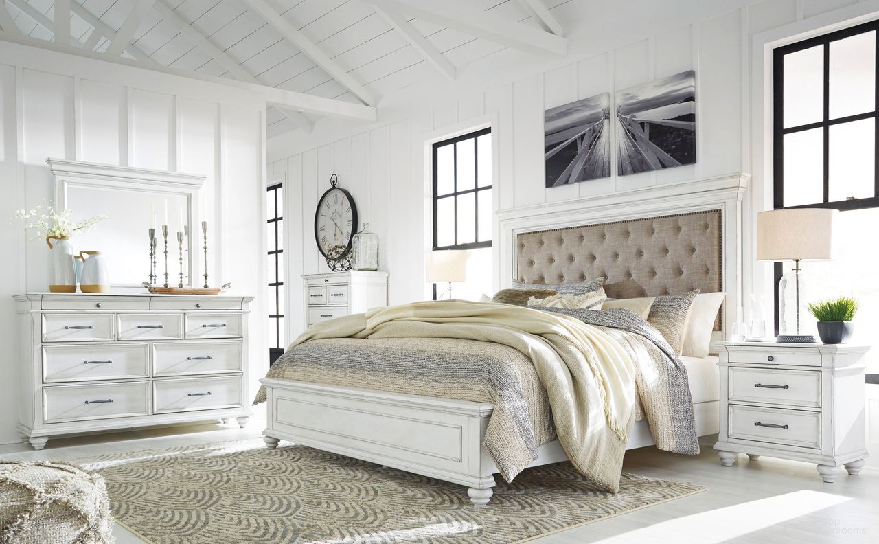The appearance of Kanwyn Bedroom Set In White Wash designed by Signature Design by Ashley in the transitional interior design. This white wash piece of furniture  was selected by 1StopBedrooms from Kanwyn Collection to add a touch of cosiness and style into your home. Sku: B777-54;B777-96;B777-157;B777-93. Bed Type: Panel Bed. Material: Fabric. Bed Size: Queen.