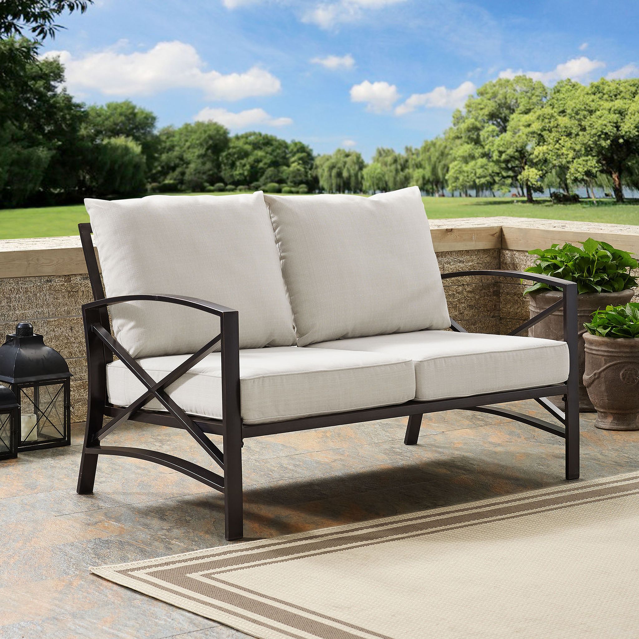 The appearance of Kaplan Outdoor Loveseat In Oatmeal and Oil Rubbed Bronze designed by Crosley Brands in the traditional interior design. This oatmeal piece of furniture was selected by 1StopBedrooms from Kaplan Collection to add a touch of cosiness and style into your home. Sku: CO6110-BZ;MO74938-OL. Material: Polyester.