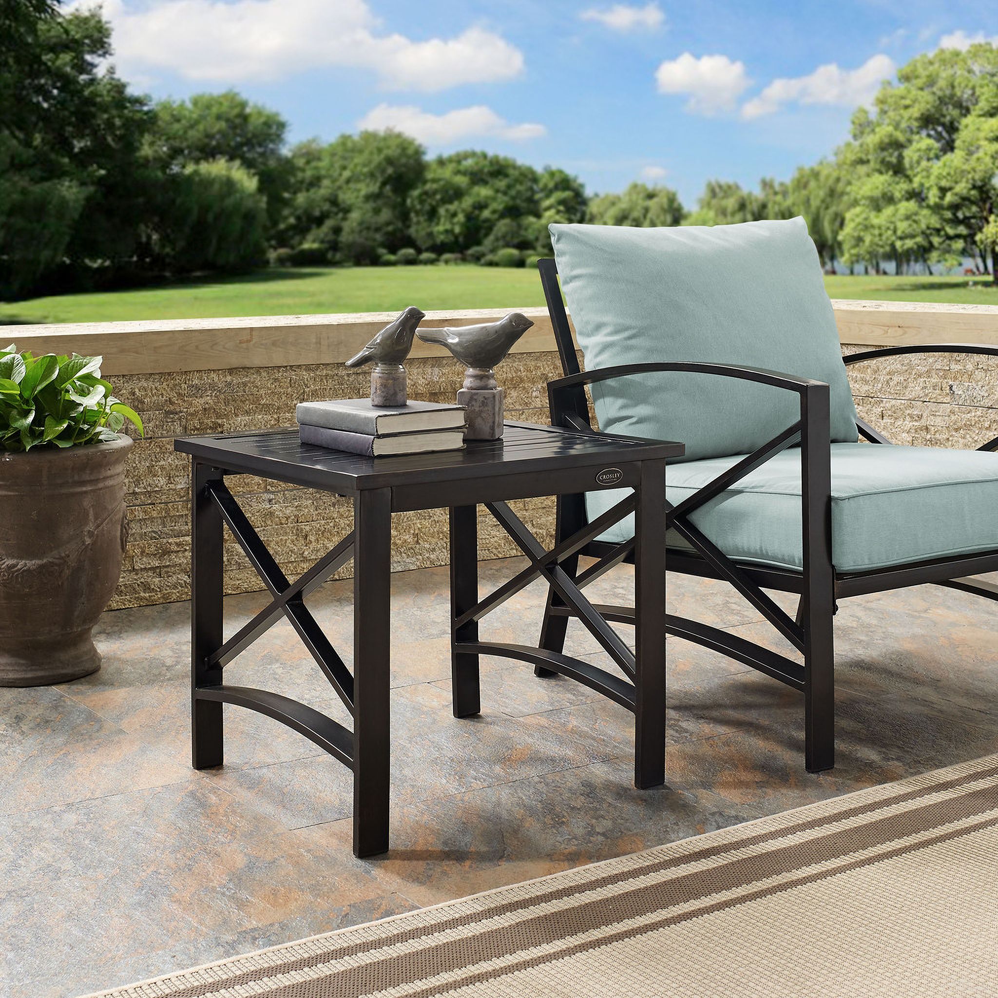 The appearance of Kaplan Outdoor Side Table In Oil Rubbed Bronze designed by Crosley Brands in the traditional interior design. This oil rubbed bronze piece of furniture  was selected by 1StopBedrooms from Kaplan Collection to add a touch of cosiness and style into your home. Sku: CO6208-BZ. Material: Steel.